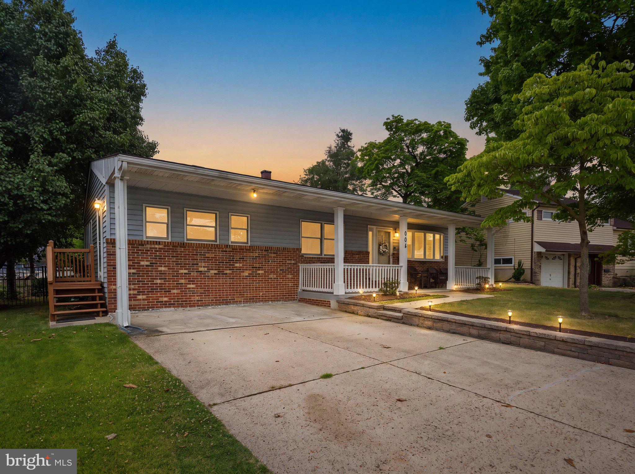 Spacious split level in Glen Burnie Park! This 4-bedroom, 2-bath home offers over 2,000+ finished square feet of comfortable living space with plenty of room to spread out. The partial brick front and expansive covered front porch create excellent curb appeal and provide the perfect spot to relax outdoors. Inside, the living and dining rooms feature durable LVP flooring, while the bright living room is highlighted by a large bay window that fills the space with natural light. The kitchen offers ample wood cabinetry and countertop space, along with a wall oven, built-in pantry, and an adjoining sitting room. The lower level is home to a private primary suite featuring recessed lighting, a stylish accent wall, and an updated en-suite bathroom complete with a sliding barn door, modern fixtures, and a beautifully tiled shower. Upstairs, you'll find three additional generously sized bedrooms and a second full bathroom, offering flexibility for family, guests, or a home office. Step outside through the rear door on the main floor to a spacious wood deck overlooking the large backyard, complete with two storage sheds for all your outdoor equipment and hobbies. Just 3 blocks away from the community pool and elementary school. Close proximity to shops and highways for everyday convenience. This home is ready for its next owner, so schedule your showing today!