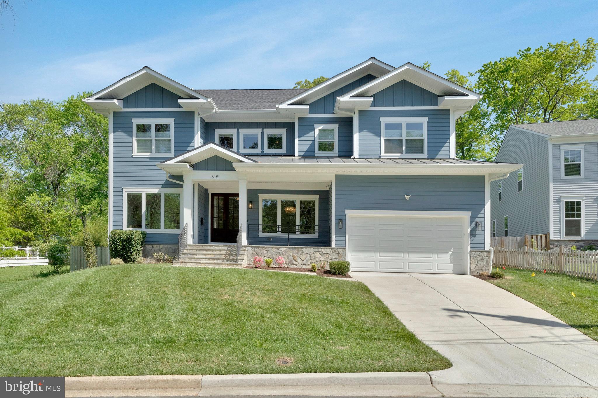 AVAILABLE FOR IMMEDIATE MOVE IN!!!
Stately Craftsman in Vienna Woods | Over 6,000 Sq Ft | Built in 2021

Welcome to Vienna Woods in the heart of the Town of Vienna—where timeless craftsmanship meets modern innovation. This expansive, like-new home offers over 6,000 square feet of luxury living, built in 2021 with meticulous attention to detail and an abundance of high-end upgrades throughout.

Step inside through a charming covered flagstone front porch and double-door entry, and you'll immediately be greeted by gleaming oak hardwood floors and soaring ceilings with coffered, tray, and custom molding details. The main level features a formal living room and elegant dining room illuminated by a sparkling crystal chandelier—perfect for elevated entertaining.

The thoughtfully designed floor plan leads you past a private home office and stylish powder room into a sun-drenched family room boasting a floor-to-ceiling Heatilator gas fireplace and a full wall of windows overlooking the backyard. A TV-ready wall-mount lift is already installed and conveys with the home. TV does not convey.

The open-concept chef’s kitchen is a true showstopper, featuring professional-grade stainless appliances including a 6-burner gas cooktop, double wall ovens, side-by-side refrigerator, under-cabinet lighting, farmhouse sink, and a custom beverage center. Casual dining options abound at the center island, breakfast nook, or out on the Trex deck—ideal for evenings under the stars. The butler’s pantry, walk-in pantry, and mudroom with access to the 2-car garage complete this level.

Upstairs, you'll find four generously sized ensuite bedrooms, each with walk-in closets and private baths. The luxurious primary suite includes a private entry foyer, two walk-in closets, and a spa-inspired bath with a free-standing soaking tub, dual vanities, built-in shelving, and a massive walk-in shower. The wall-mounted 65” TV in this bedroom conveys. The second level also includes a light-filled laundry room and a cozy loft with built-ins and bench storage - perfect as a reading nook. 

The lower level offers even more lifestyle flexibility with a Dolby ATMOS-equipped home theater (JVC 4K projector, 110” Stewart screen, 10-speaker Marantz system, Apple TV—a $35K value), a recreation/game room with access to the outside, an exercise room with rubber flooring, a half bath, and two additional bedrooms, one with a private full bath.

This is not just a home - it’s a smart, secure, and sophisticated lifestyle nestled in one of Northern Virginia’s most sought-after neighborhoods.

Smart Features & High-End Upgrades:

ChargePoint HomeFlex Level 2 EV charger

Chamberlain Wi-Fi garage door opener

Whole-home Ring alarm system

Ubiquiti Unifi Dream Machine Pro WiFi & security (incl. 4 perimeter cameras + G4 doorbell)

Lutron Caseta smart lighting throughout

U-Bolt Pro Series smart locks

ecobee SmartThermostats (2 zones with voice control)

Digitally controlled Rachio 3 WiFi sprinkler system

Low E, Argon gas window upgrades

Watchdog battery backup sump pump

Fenced rear yard (installed 2025)