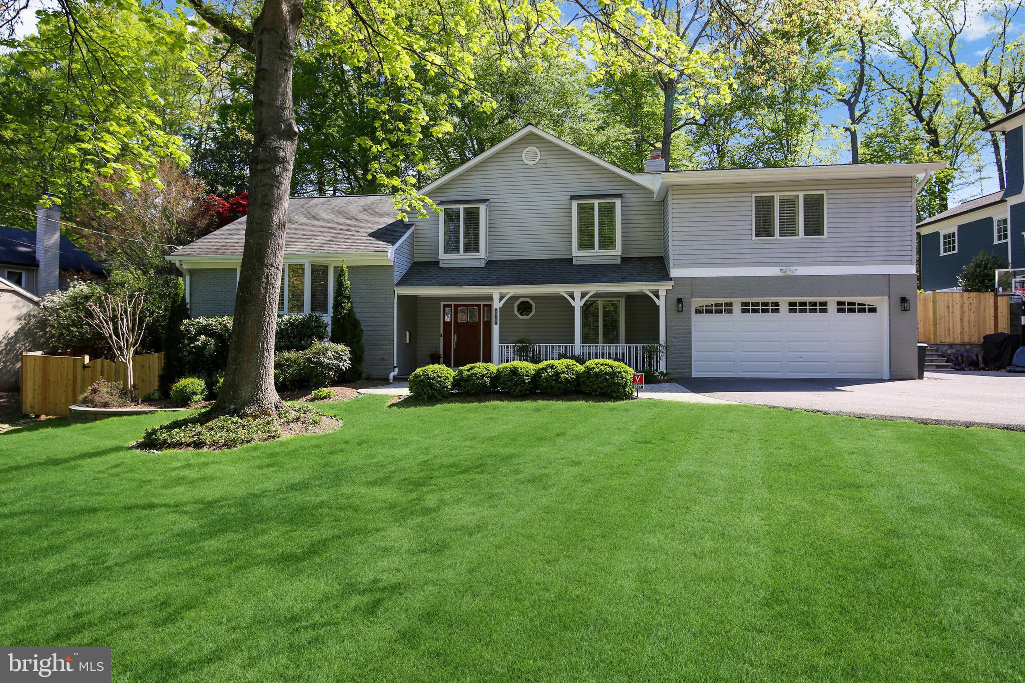 Welcome to this incredibly spacious five level contemporary home located in the coveted Whitman school district.  Featuring four bedrooms, three full baths, one half bath, an open-concept floor plan, two car garage and an expansive fenced yard, this light-filled home has so much to offer!  The inviting front porch leads to a welcoming foyer. To the right is a terrific mud room featuring custom built-ins and also providing access to the oversized two car garage.  Additionally, you’ll find a convenient laundry room with great closet storage, a tasteful utility sink, and a beautifully updated powder room.  Continue through the foyer to find a wonderful family room complete with a wood-burning fireplace and french doors leading to a flagstone patio, perfect for entertaining.  Travel up to the next level where you’ll find an amazing gourmet kitchen, complete with stainless steel appliances, silestone counters and tons of cabinetry for great storage.  There’s a separate breakfast area with doors leading to a low-maintenance Trex deck.  The kitchen is also open to a formal dining room and an elegant living room with a bright bay window.    Continue to the bedroom level and discover a gorgeous expanded owner’s suite with vaulted ceilings, a huge walk-in closet and a luxurious bath featuring a dual vanity, quartzite countertops, designer tile and lighting, an oversized shower stall and a separate air jet soaking tub.  There’s an additional en-suite bedroom on this level with a tastefully renovated bath, as well as two additional bedrooms and a third beautifully renovated hall bath.  All bedrooms feature new hardwood floors.  Downstairs you’ll find great space to utilize as a home gym or recreation room, as well as an awesome walk-in pantry for additional storage.  There’s also a private home office/flex space, with an adjacent exterior door ideal for easy client access.    The current owners have invested in many property upgrades and have created a turn-key home with a breathtaking lot, in superb move-in condition.  Ideally located just moments from downtown Bethesda, countless parks and trails, shopping, dining and other entertainment, and in a private and quiet neighborhood, this home is the perfect 10!