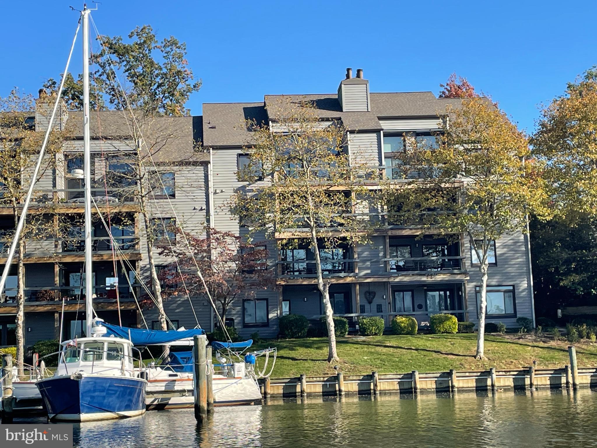 Once in a while, a home comes on the market that separates it from the rest. This unique gem has 2 bedrooms plus a den/office. Live your dream of resort-living on the Annapolis waterfront. This meticulously maintained condominium includes a deeded 45' slip, C38, with 10 MLW and a dock box. The all-one-level living is bathed in natural light with expansive year-round water views of Spa Creek from every room. An updated kitchen includes a dinette with water views and a spacious pantry with an additional storage room. A sliding glass door in the kitchen leads to a large brick patio ideal for entertaining. Grill while watching the boats pass by.  A large living room with 3 sides of windows face the water to invite relaxation and family enjoyment. A wood-burning fireplace with mantle in cozy den/office with additional built-in desks and a parquet floor. The roomy laundry room includes a  whole house water conditioning/softening system and additional storage.  Largest terrace home in Shearwater.  Spectacular sunset views all year long. Spa Creek is one of the most sought-after waterways in all of Annapolis taking you to downtown Ego Alley, the Severn River, and onward to the Chesapeake Bay. Observe blue herons, egrets, ducks, and bald eagles from your private, 40 ft. deck in this nature watchers' paradise.  Enjoy coveted Western exposure. The minute you exit your home, indulge yourself with some of the best waterfront amenities found in the City. Waterfront pool, kayak launch, dinghy floating dock, pickleball, tennis, and deep water marina, are all within a gated community. Located in Eastport you will walk to parks, restaurants, and over the Spa Creek Bridge to downtown Historic Annapolis. A rare find.