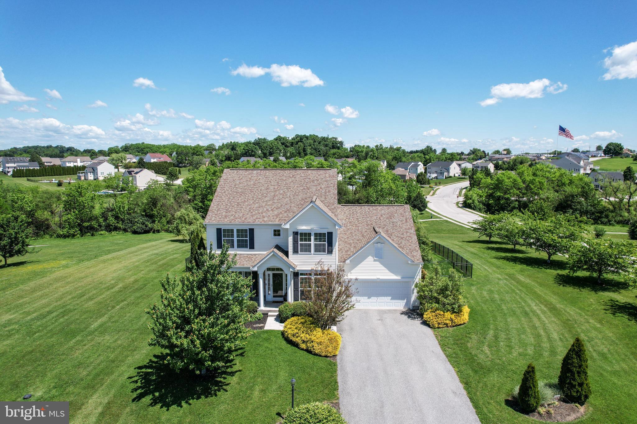 Originally the model home for Reservoir Heights, this lovely residence offers four spacious bedrooms, a private library, three full baths, and one-half bath. Thoughtfully designed with an open and inviting floor plan, the home features a bright sunroom and a unique staircase placement that creates a more private and welcoming main entrance.

Situated on a spacious corner lot within a cul-de-sac, the property backs to an open community walking trail, providing peaceful views and added privacy. Outdoor living is exceptional with low-maintenance decking, an awesome custom stone paver patio, and beautiful sunset views to enjoy each evening. The partially fenced yard offers plenty of open space for entertaining, play, or simply relaxing outdoors.

The upper-level features four generously sized bedrooms, including a spacious primary suite with scenic views and a large primary bath. The mostly finished lower level is another well-designed feature of the home, offering multiple finished spaces for entertaining, hobbies, or recreation, while still providing abundant storage and an additional full bath.

Additional highlights include a 2018 roof, natural gas heating and cooking, and impressive energy efficiency upgrades. This exceptional home is sure to please buyers with refined taste who appreciate comfort, quality, and thoughtful design.