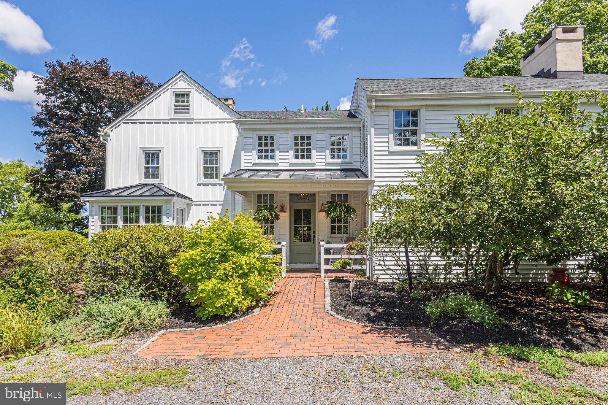 Set upon nearly three picturesque acres, this exceptional stone farmhouse artfully blends timeless character with refined modern comforts.  Rich in heritage, the home showcases an array of original architectural details, including random-width pine floors, deep-set windowsills, six fireplaces, and distinctive handcrafted millwork throughout.  A gracious foyer welcomes you and thoughtfully connects a charming screened porch to lush, mature gardens and a serene pool area—creating an effortless indoor-outdoor lifestyle. The main level is designed for both everyday living and elegant entertaining, featuring a spacious great room with exposed beams, a well-appointed farmhouse kitchen, and inviting living and dining rooms brimming with warmth and character.  Upstairs, the light-filled primary suite offers a peaceful retreat, complete with generous closet space, a fireplace, and a spa-like bath. Two additional bedrooms, a full bath, a conveniently located laundry area, and a cozy library complete the second level. The third floor presents a private suite with a full bath, ideal for guests or extended family.  A classic rustic barn is also located on the property, offering countless opportunities for additional living and entertaining space, a studio, or extensive storage, further enhancing the estate’s versatility and charm.  Perfectly balancing its tranquil, country setting with accessibility, this rare offering provides convenient commuting to both New York City, Princeton and Philadelphia. In addition, the Washington Crossing State Park and the Canal tow path are in close proximity. Award-winning Council Rock School District.