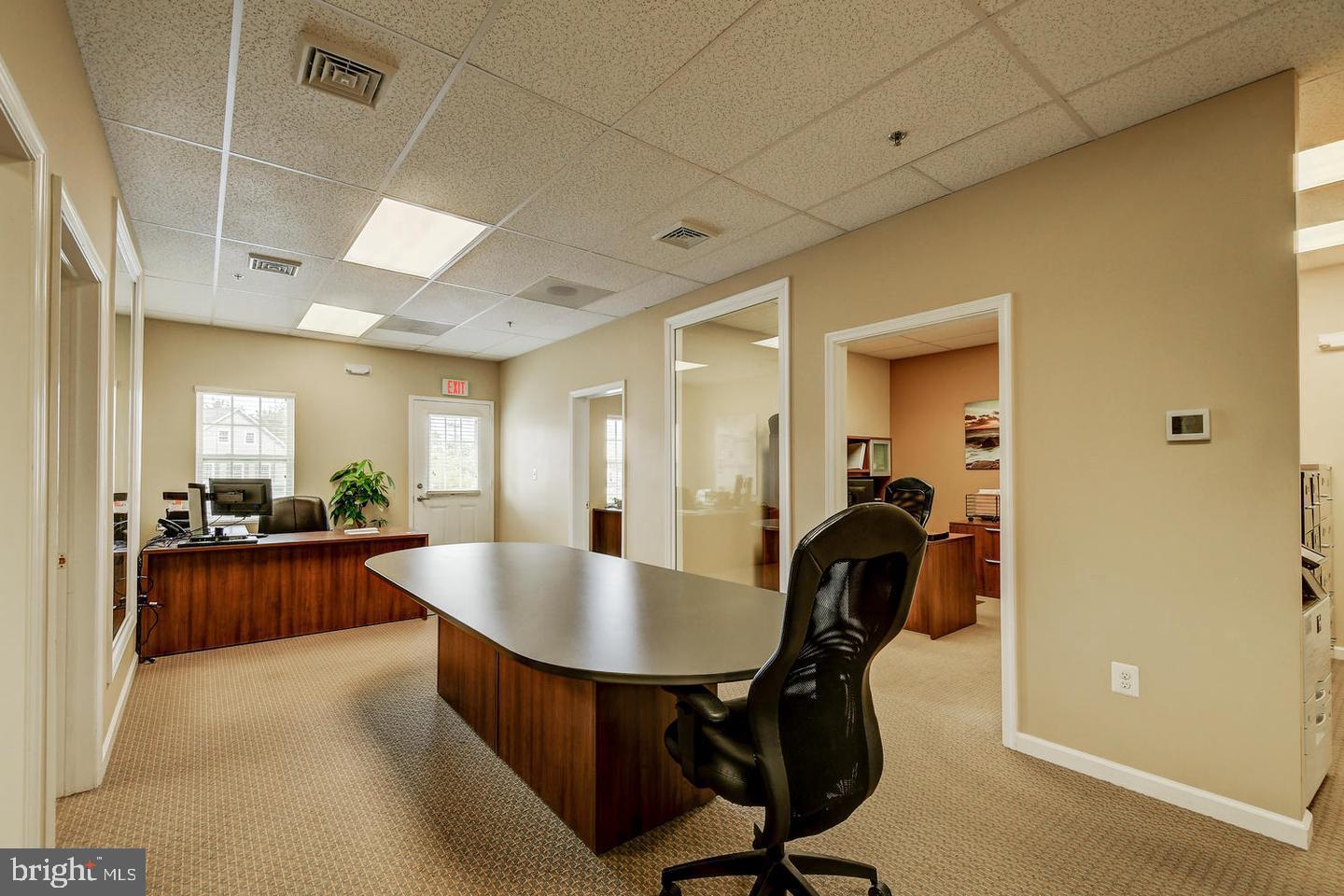 Spacious and professionally designed 1,215 SF second-floor office condo located in the desirable Highland Crossing Professional Office Park in Western Howard County. Suite #203 in Building E features a bright and welcoming reception/conference area, five private offices with single-light glass doors and observance windows, a dedicated file/copier area, kitchenette, and convenience bath. Private rear stairway exit. Building includes an exterior elevator and private stairwell with direct suite access. Ideal for professional, medical, or administrative use. Ample parking and strong area demographics.