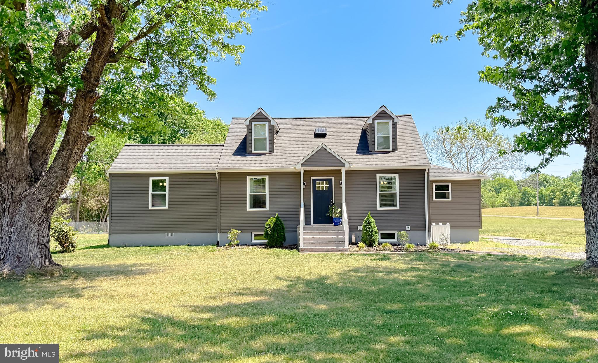 Welcome to 4985 Solomons Island Road — a truly one-of-a-kind property that blends modern updates and charm on a beautifully landscaped lot in Huntingtown, MD. Completely rebuilt and renovated in 2022, this immaculate home offers peace of mind with major system upgrades including a new roof, HVAC, septic, water heater, kitchen appliances, flooring, electrical, plumbing, fixtures, and more. Every detail has been thoughtfully updated while still maintaining the character and uniqueness that sets this property apart from the typical “cookie cutter” home.
Located in the highly sought-after Huntingtown school district — one of the most desirable areas in Calvert County — this property offers not only a beautiful home, but also the lifestyle and location buyers are actively searching for.
Surrounded by mature trees, flowering bushes, and expansive outdoor space, this property was designed for enjoying both everyday living and entertaining. The backyard features a spacious patio, landscape lighting, irrigated garden area, and plenty of room to relax, host gatherings, or simply enjoy the setting. Additional improvements include a vapor barrier and insulation in the crawl space and a multistage water filtration and softening system. 
Conveniently located with easy access to PAX River, Joint Base Andrews, Washington DC, and Annapolis, this home offers the perfect combination of space and accessibility. No HOA means more freedom to truly make the property your own. A barn on the property conveys as-is and offers additional storage or hobby space opportunities. Recent 2025 survey completed.
This is the kind of property that rarely comes along — updated, full of character, and move-in ready in one of Calvert County’s most sought-after locations.