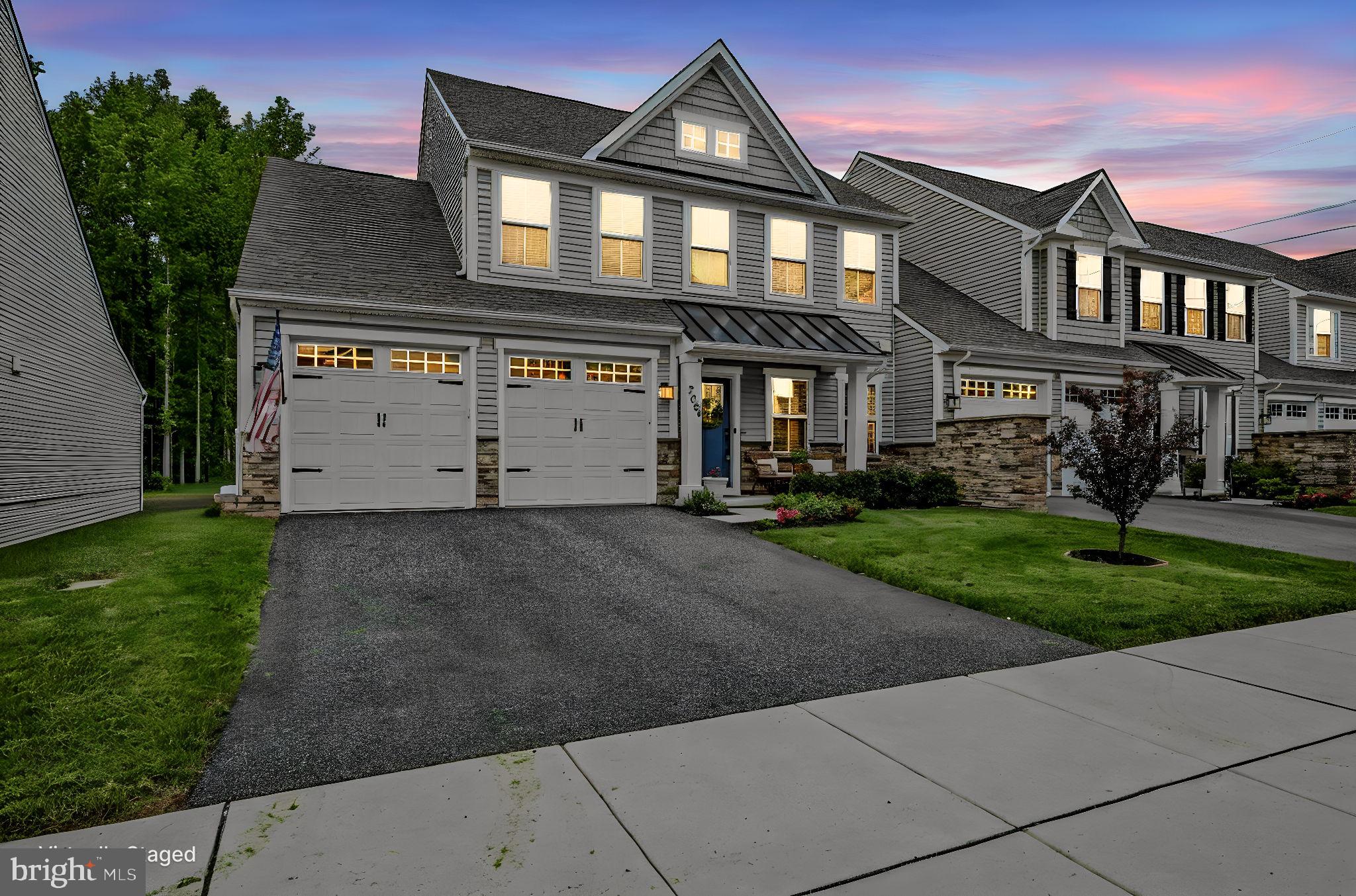 From the moment you arrive, this home impresses with beautiful curb appeal, a landscaped yard, covered front porch, and spacious two-car garage. Inside, the thoughtfully designed open floor plan is filled with natural light and enhanced by rich wood flooring that flows throughout the entire main level.
<br><br>
At the heart of the home is a stunning gourmet kitchen designed for both everyday living and entertaining. A massive center island with pendant lighting and bar seating creates the perfect gathering space, while upgraded countertops, subway tile backsplash, stainless steel appliances, and abundant prep space elevate both style and function. The kitchen opens seamlessly to the spacious family room featuring soaring ceilings that create an airy and inviting atmosphere.
<br><br>
Just off the main living area, the morning room extension offers exceptional versatility and can easily serve as a home office, playroom, sitting room, or additional dining space depending on your lifestyle needs.
The main-level primary suite provides a private retreat complete with a tray ceiling, oversized walk-in closet, and luxurious spa-inspired bathroom featuring a double vanity and frameless glass walk-in shower.
<br><br>
Upstairs, a spacious loft with plush carpeting offers the perfect secondary living space for guests, movie nights, or a quiet lounge area. Two additional bedrooms and a full bathroom complete the upper level, providing comfortable accommodations for family and visitors alike.
<br><br>
Outside, the backyard backs to a peaceful wooded area, creating a private natural backdrop with endless potential to design your dream outdoor living space, whether it’s a future patio, firepit area, or garden retreat.
<br><br>
Adding to the ease of everyday living, the HOA includes lawn maintenance services such as grass cutting and fertilization, as well as snow plowing and driveway shoveling during winter weather. Trash service is also included, allowing for a truly low-maintenance lifestyle and more time to simply enjoy your home and community.
