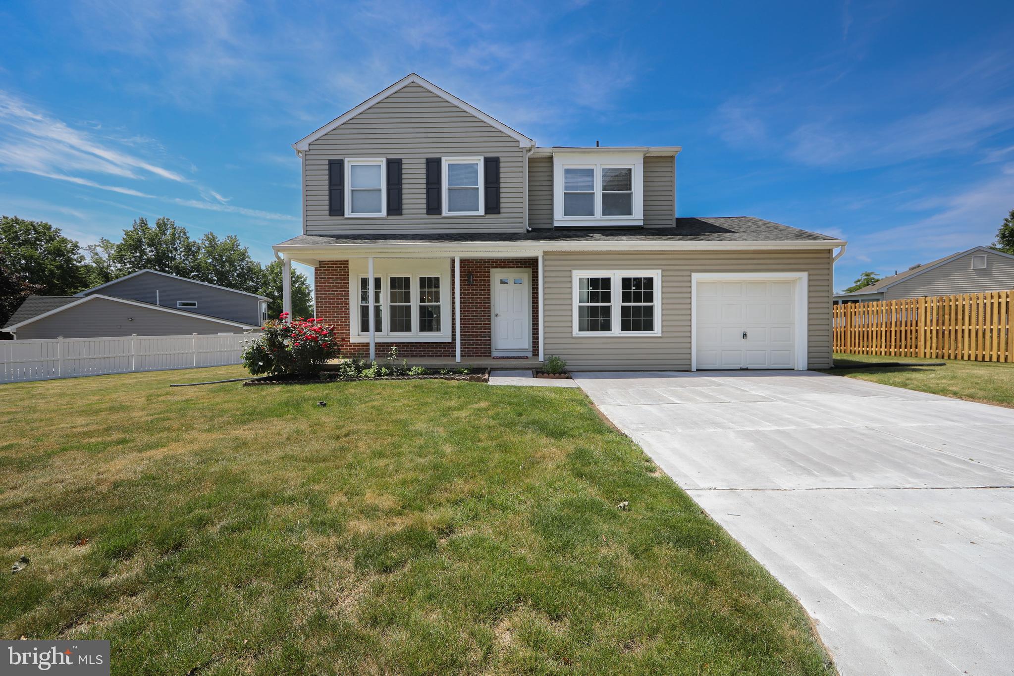 This spacious colonial  is tucked away on a beautiful tree-lined street in the desirable Springdale section of Neshaminy Valley in Bensalem. From the moment you arrive, you’ll appreciate the wonderful curb appeal, charming front porch, and spacious concrete driveway that set the tone for all this home has to offer. Step inside and immediately appreciate the continuous solid Brazian Cherry hardwood flooring that flows throughout much of the home. The formal living and dining rooms are open to one another, creating a wonderful gathering space for entertaining family and friends. The kitchen sits at the heart of the home, featuring beautiful granite countertops, newer appliances, and a layout that overlooks the inviting family room with vaulted ceilings and sliding glass doors leading to the backyard and patio. Just off the kitchen you’ll find a convenient laundry room, half bath, and a large first-floor flex space that was previously converted from the garage and used as a main-floor bedroom — perfect for guests, a home office, playroom, or additional living area. The conversion was thoughtfully designed to still maintain a separate storage area. Upstairs, the beautiful bamboo flooring continues through the hallway and bedrooms. The impressive primary suite features elegant French doors, generous space, three closets including a large walk-in closet, and a private ensuite bathroom. Two additional spacious bedrooms and a full hall bathroom complete the second floor, along with pull-down stairs providing easy attic access. Need more space? The clean, dry unfinished basement offers high ceilings and endless possibilities. Finish it for additional living space or take advantage of the incredible storage, including an additional crawl space with convenient utility access. Outside, enjoy a backyard ready for your vision with a patio and plenty of room to relax, play, garden, or entertain. Enjoy a convenient location within walking distance to the community park and close to schools, shopping, dining, major roadways, and everything Bensalem has to offer. This wonderful home combines space, comfort, and location — add your personal touches and make it truly your own. Welcome home!