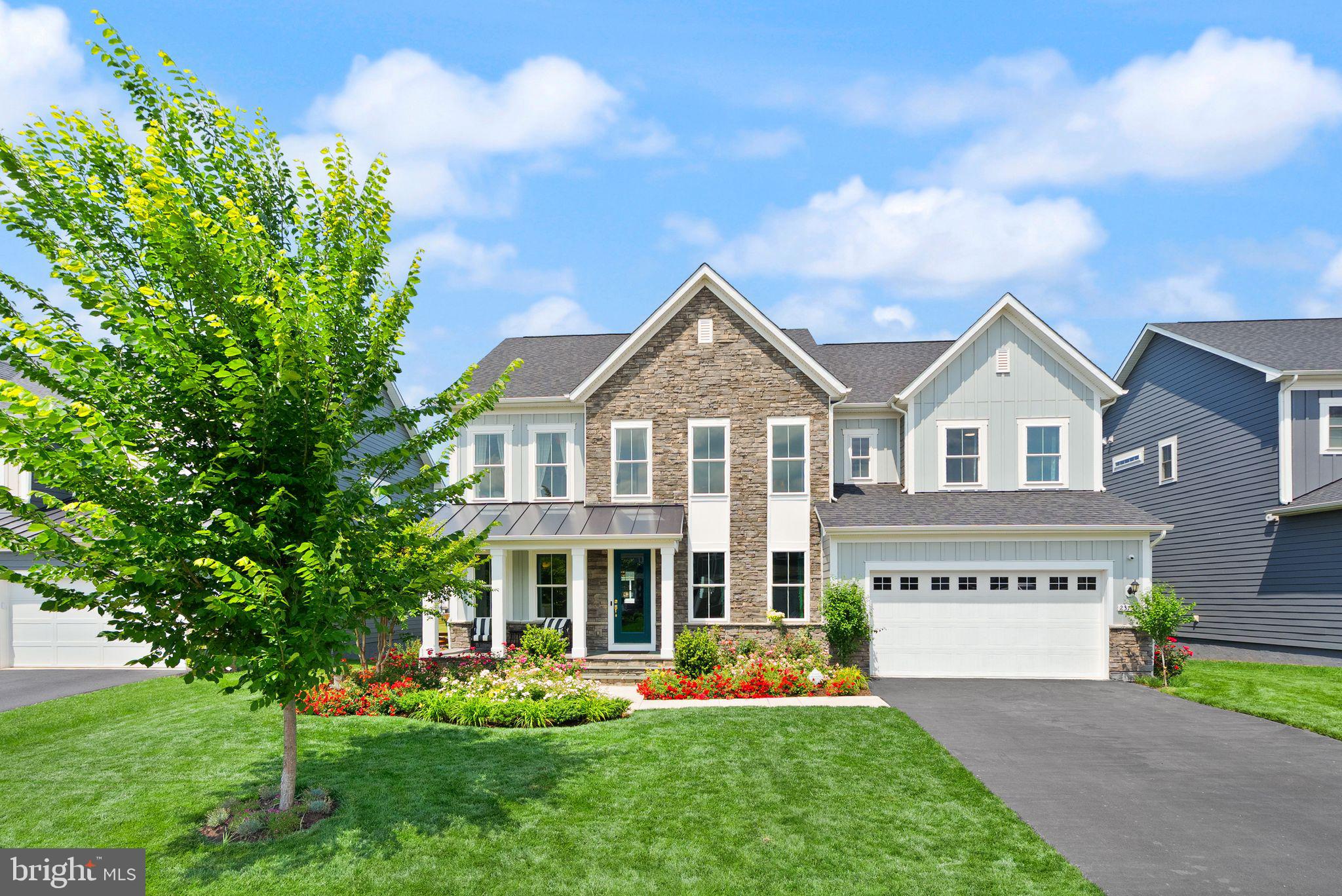 Set against a serene pond backdrop in the prestigious Hartland community of Aldie, this extensively upgraded 7-bedroom, 4.5-bath estate offers a rare blend of luxury, functionality, and breathtaking water views.

Designed for both grand entertaining and everyday comfort, the home showcases a renovated gourmet kitchen, designer finishes throughout, custom oak staircases, beautifully updated bathrooms, and sophisticated lighting enhancements across all three levels.

The fully permitted lower level has been transformed into a private living retreat featuring a spacious gathering room, gourmet kitchen, dining area, bedroom suite, spa-inspired bath with Italian marble shower, dedicated laundry, and private access—providing exceptional flexibility for multigenerational living, extended guests, or long-term guests.

Outdoor living is equally impressive, with professionally curated landscaping, a smart irrigation system, and a custom Trex staircase connecting the morning room to the backyard. From the rear of the home, enjoy peaceful pond views that create a picturesque setting year-round.

Located within Hartland, one of Aldie's premier master-planned communities, residents enjoy miles of scenic trails, resort-style pool and amenities, parks ,  playgrounds, community gathering spaces, and convenient access to top-rated schools, shopping, dining, and major commuter routes.

Combining expansive living spaces, exceptional upgrades, tranquil water views, and an outstanding community setting, this is a truly turnkey luxury residence in one of Loudoun County's most sought-after neighborhoods.