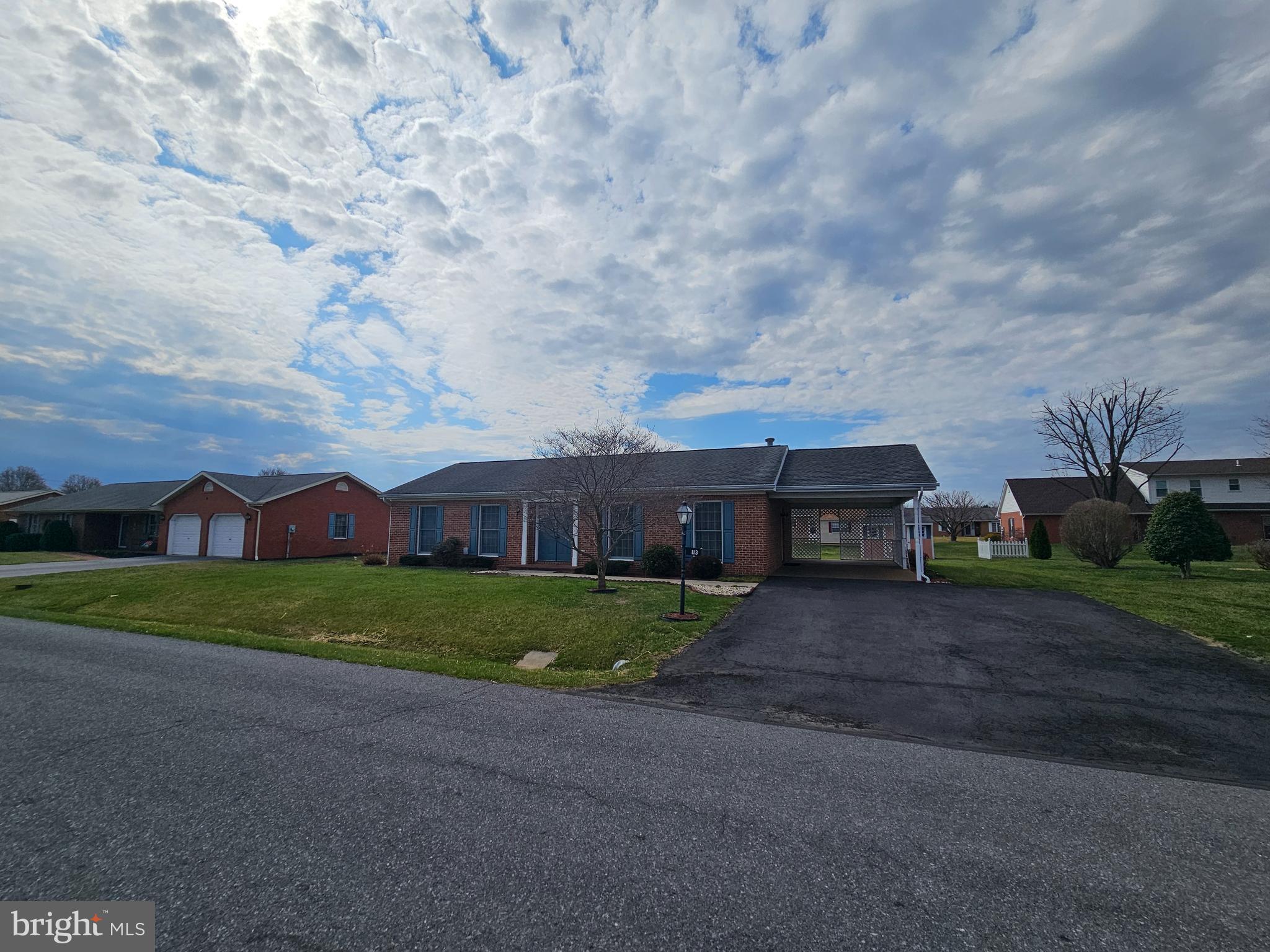 All brick "easy to maintain" rancher on level lot in South Pointe subdivision. Living room with gas fireplace.  Owners suite with full bath, 2 additional bedrooms and 1 full bath.  Main level laundry. Carport and rear patio, shed conveys.  Roof is under 10 yrs old and water heater was replaced in 2024.  Full unfinished basement.