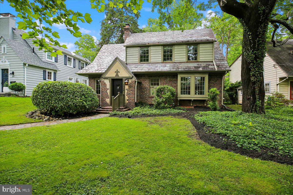 Nestled on one of the premier streets in Chevy Chase Village, this enchanting 1920s home - a blend of English Country Cottage and Gothic Revival - marries storybook charm with elegant modern renovations. From the moment you step inside, beautiful hardwood floors guide you through a thoughtfully designed main level boasting multiple versatile living areas. Working from home is a delight in the sun-drenched main-level office, complete with a wall of custom built-in shelving. The inviting living room anchors the home with its cozy fireplace, flowing seamlessly into a spacious formal dining room and a well-appointed kitchen featuring stainless steel appliances and ample cabinet space. Serving as the true heart of the home, a spectacular family sunroom, enveloped in beautiful bay-panel windows, offers a serene retreat for everyday living.

As you ascend to the upper level, a distinctive circular window on the stair landing frames a picturesque view of the upper-level balcony. This floor hosts three generous bedrooms and two full bathrooms, including a peaceful rear bedroom with direct access to the private balcony—the perfect spot for starry nights and quiet morning coffee. Downstairs, the lower level provides excellent storage solutions to keep the home organized and clutter-free.

The exterior of the property is equally impressive,  exemplified by the texture, detail, and rich character of its genuine Vermont slate roof. Tucked away at the rear, a private alley-accessible two-car garage features an upper level with endless possibilities for your best ideas.

As you head out from the picturesque tree-lined streets and brick sidewalks of Chevy Chase Village, you are just moments away from the premier dining, shopping, and entertainment of downtown Bethesda and Friendship Heights. Commuting is effortless with two nearby Metro stations, while outdoor enthusiasts will love the proximity to the scenic trails of Rock Creek Park. Complete with easy access to both the Chevy Chase Club and Columbia Country Club, this property represents an unparalleled opportunity to own a piece of one of the area's most prestigious neighborhoods.