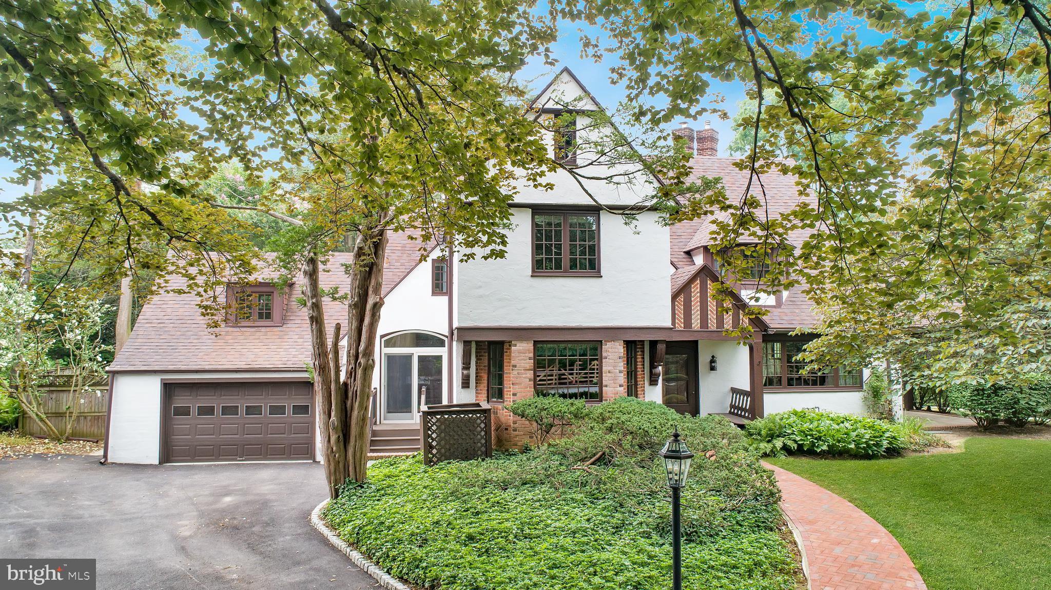 Welcome to 556 Saint Davids Avenue, an architecturally significant English Tudor nestled in the heart of prestigious Saint Davids within Radnor Township. Rich in timeless craftsmanship and thoughtfully updated, this exceptional residence showcases distinctive period architecture, premium improvements, and modern comforts in one of the Main Line's most coveted neighborhoods.
A welcoming covered front porch with a built-in bench opens to a gracious center hall featuring hardwood floors and a convenient powder room. The inviting living room offers hardwood flooring, Marvin replacement windows, a gas fireplace with insert, and double doors leading to an enclosed patio overlooking extensive mature landscaping. The formal dining room is highlighted by beautiful Mercer tile flooring, Marvin replacement windows, a built-in bench, and elegant wall sconces.
The beautifully updated cherry kitchen is designed for everyday living and entertaining and features stainless steel appliances, including a six burner Thermador gas range with electric convection oven, dual Monogram Advantium convection ovens, a Monogram refrigerator with interior water dispenser, Thermador warming drawer, KitchenAid dishwasher, tiled backsplash, under cabinet lighting, a built in writing desk with overhead mail station, stainless steel exhaust hood, and an Andersen sliding glass door leading outdoors.
The spacious primary suite features hardwood flooring, custom built in drawers, newer Marvin replacement windows, and a spectacular English Tudor turret alcove with a faceted vaulted ceiling and three-sided windows. The adjoining walk-in closet includes an arched opening, additional built-in storage, and newer Pella replacement windows. The luxurious marble primary bath offers a jetted soaking tub, frameless glass shower, double vanity, brass fixtures, illuminated medicine cabinets, and recessed lighting. The second bedroom features newer Marvin replacement windows and an updated en suite bath, while two additional bedrooms offer hardwood flooring, generous closet space, and flexibility for family, guests, or a home office.
Additional highlights include a recently replaced driveway, newer generator, an attached two car garage with inside access and a ½ HP automatic garage door opener, a partially finished basement with a Maytag washer, Kenmore dryer, and utility sink, both high velocity and conventional ducted central air conditioning systems for year round comfort, updated 200 amp electrical service, original mortised locks, solid wood doors, brass hardware throughout, and a Weil McLain WM97+ high efficiency gas boiler with an integrated tankless hot water system.
Located within the award-winning Radnor Township School District, this exceptional residence is just a short walk to the Saint Davids SEPTA Regional Rail Station on the Paoli Thorndale Line, providing convenient rail service to Center City Philadelphia and beyond. Enjoy quick access to Routes 30 and 202, I-476 (Blue Route), I-76 (Schuylkill Expressway), and the Pennsylvania Turnpike. Just minutes away are the acclaimed restaurants, boutique shopping, coffee shops, and vibrant atmosphere of Downtown Wayne. Nearby Main Line Health, Bryn Mawr Hospital, Lankenau Medical Center, Penn Medicine, parks, walking trails, golf courses, and country clubs complete the outstanding Main Line lifestyle offered by this remarkable home.


Don't miss our exclusive website for this home, featuring a 3D Matterport tour, Virtual Reality Walkthrough, detailed floor plan, professional photography, aerial drone neighborhood footage. Note: Some photos have been digitally enhanced