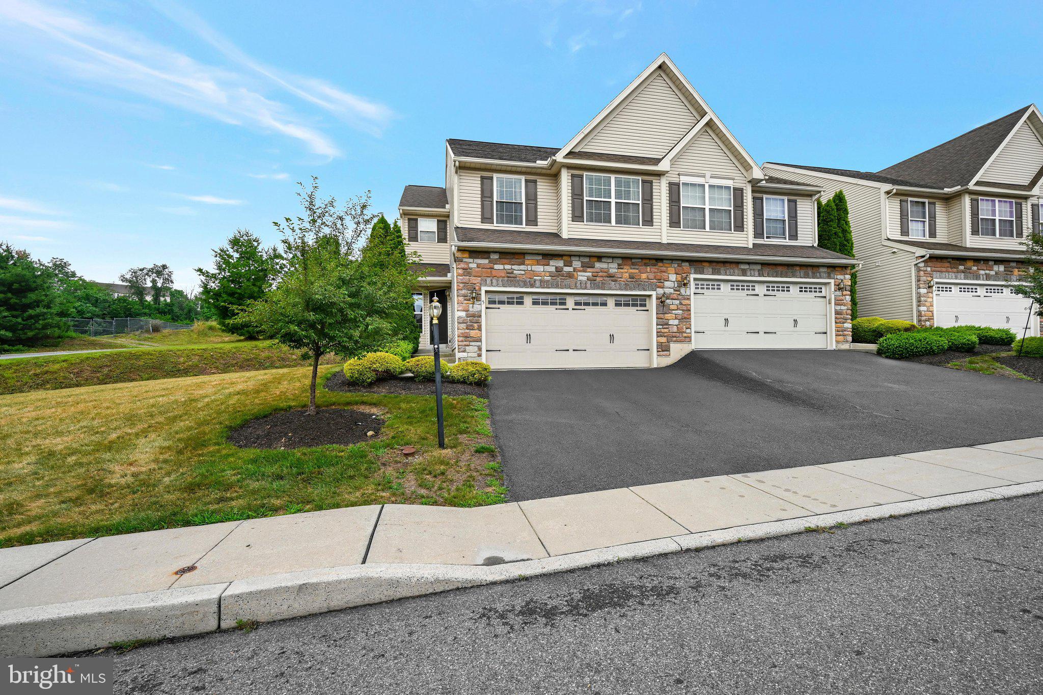 Ready-to-occupy spacious, rare end-unit townhome in the Sunnyside development. This home has been tastefully updated with neutral colors, a recently drywalled 2-car garage, and a partially finished basement. The main level features a spacious living room, a separate dining room, and a kitchen with ample cabinets, a kitchen island, and all appliances remaining. Patio doors lead out to a rear deck in the backyard. An updated powder room is also on the first floor. The second floor features a primary bedroom in the front of the home with a full bath and walk-in closet. Laundry room/Closet in the hallway, along with a full bath. Two bedrooms in the back of the home. The lower level features a newer, partially finished family room. Hardwood flooring on the first floor, newer carpet on the second floor, and freshly painted, upgraded fixtures throughout. HOA includes common areas, maintenance, lawn cutting, and snow removal.