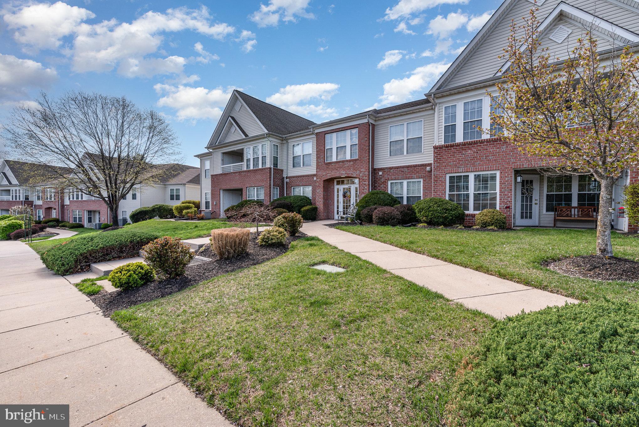Welcome to carefree condo living in coveted Taylor Ridge! This beautifully updated 2nd-floor corner condo offers one of the largest floor plans in the community! This home is designed for comfort and convenience with 2 spacious bedrooms, a versatile den (perfect as a 3rd bedroom or office), with two full baths (2023).

Step into the foyer with recently installed luxury waterproof (laminate) plank flooring that leads into the airy living and dining area, which is highlighted by soaring vaulted ceilings and also to the kitchen, laundry, den and large storage closet. The gorgeous gourmet kitchen, fully updated in 2023, boasts white semi-custom Kraftmaid cabinetry, quartz countertops, under-cabinet lighting, and stainless-steel appliances (2021) including a bottom drawer freezer refrigerator, gas range with air fryer feature and griddle, microwave, and ultra-quiet dishwasher. A sunlit breakfast room opens to a private balcony overlooking serene green space—perfect for morning coffee or evening relaxation.

The generously sized owner’s suite features a walk-in closet with customizable shelving and a fully remodeled en-suite bath with an oversized shower. The second bedroom is equally roomy; the second bath is also updated with modern tile, new fixtures, and vanity, and the den adds an additional room providing flexible living space. Ample storage in a large bonus closet, a separate laundry room with utility sink and added shelving, and updated HVAC (2023) complete this amazing condo.

Enjoy resort-style amenities including a swimming pool, fitness center, tennis courts, and community clubhouse. Easy living in a vibrant, well-maintained neighborhood with plenty of parking and great curb appeal—this is truly a place to call home!
