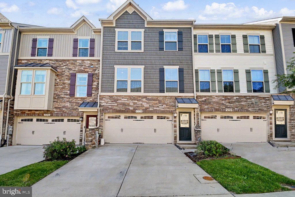 RESORT STYLE LIVING FEATURING CLUBHOUSE, SWIMMING POOL, FITNESS CENTER, WALKING TRAILS, DOG PARK AND MORE!!!  3 LEVEL CRAFTSMAN STYLE TOWNHOUSE WITH ATTACHED TWO CAR GARAGE!!!  OPEN CONCEPT FLOOR PLAN!!!  GOURMET KITCHEN DESIGNED TO IMPRESS WITH MASSIVE CENTER ISLAND, GRANITE COUNTER TOPS, 42" KITCHEN CABINETS, STAINLESS APPLIANCES AND PANTRY.  THERE IS A LARGE DECK OFF THE DINING AREA!!!  GRAND PRIMARY SUITE WITH A WALK IN CLOSET AND A HUGE PRIMARY BATH WITH SOAKING TUB, WALK IN SHOWER AND DUAL VANITIES.   THE UPPER LEVEL HAS TWO ADDITIONAL BEDROOMS WITH SPACIOUS CLOSET SPACE, A FULL HALL BATH AND LAUNDRY ROOM!!!  THE FULLY FINISHED LOWER LEVEL OFFERS ENDLESS POSSIBILITIES AND IS IDEAL FOR A HOME GYM, 4TH BEDROOM, A MEDIA ROOM OR PLAYROOM AND IS EQUIPED WITH A FULL BATH!!!  ELEVATE YOUR LIFESTYLE....GO SEE THIS HOME!!!
