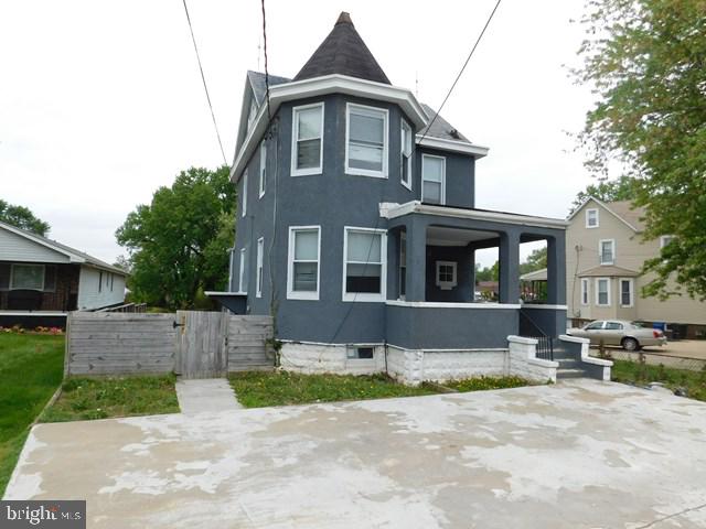 This spacious 3 bedroom, 3.5 bath Victorian home features 4 finished levels of living space. A charming front porch with a stained glass front door with glass storm door, concrete driveway with off street parking and large deck with steps to the fenced back yard create outdoor appeal. Inside, lots of updates have been done, needs some work but features rich hardwood flooring,  a living room area with a graceful bowed wall of windows, kitchen and dining area with French doors that open to the large deck and a powder room on the main level. Hardwood floors continue upstairs where you'll find two light filled bedrooms each with its own private updated bath. The uppermost level feature another spacious bedroom and 3rd full bath. The finished walk-up lower level has a recreation room, laundry room and utility rooms. Situated on a corner lot with off street parking in the quiet Cedonia community.