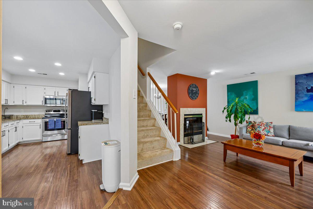 $5,000 Closing Cost Incentive! Seller is offering $5,000 closing cost credit to the buyer who ratifies a contract with us by June 10th! Sunlit and lovingly cared for, this delightful  End-Unit 2-Level Home is waiting for you! Open floor plan, windows/natural light on two sides, 3 good-sized bedrooms, 2 full baths and 1 half bath grant bright and  "easy-breezy" living convenience. The large, table-space kitchen is equal in size to those commonly found in single family homes with abundant cabinetry and counterspace, built-in microwave, and stainless steel appliances. Both the living room and dining area offer ample gathering spaces with fireplace access. This unit is one of the larger sized units in the subdivision boasting 1,356 sq. ft of space (many of the other units are 1,325 sq. ft.).  Further, some units place a bedroom on the main level. In this unit, all  three bedrooms are UPSTAIRS, satisfying those who need the convenience of being on the same floor, and granting much needed privacy from gatherings and guests below. The dining room opens up to a charming patio area via double French doors,  perfect for early morning coffee, sipping afternoon lemonade, or cook-outs and barbecues.  The large primary suite boasts two separate closets and independent "his-and-hers" sinks in the ensuite primary bath. HVAC replaced within the last 3 years, Deck floor replaced/updated, Fireplace cleaned and inspected 1 month ago and in great condition, fresh paint throughout, new carpet, in-unit washer and dryer, community pool, and plenty of unassigned parking for family and friends add to the beauty and benefits of this property.  The condo association changed the roof, siding, and patio fence within the last 5 years. Cradled between Clopper Road, Father Hurley Blvd. and Germantown Road, this home offers the peace of a quiet neighborhood yet is conveniently located, granting easy access to stores, shopping, daily essentials, restaurants, movies/entertainment, and major transit routes. Don't miss this gem; there is nothing to do but move in! Come see 32 Amarillo Court today!