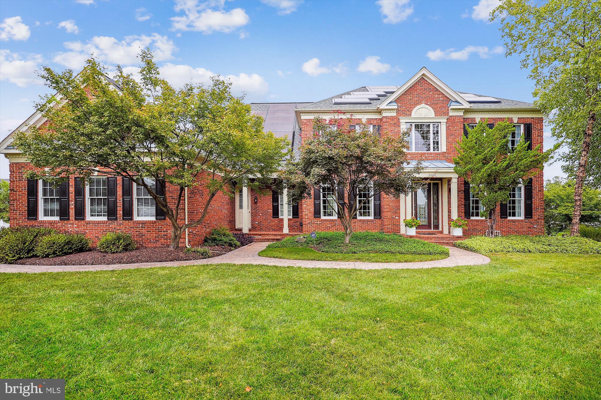 Welcome to Your Dream Home in the prestigious Chase at Belmont Country Club, a meticulously maintained Toll Brothers home showcasing over $500,000 in luxurious upgrades! This extraordinary 5-bedroom masterpiece sits on an impressive .57-acre lot surrounded by over 3-acres of landscaped common ground and boasting a grand 3-car garage. With its charming white picket rear fence and 3 gates, the home is surrounded by elegance and character. As you approach down the picturesque driveway, framed by stately brick columns, you’ll be swept away by the sheer luxury of this one-of-a-kind property. Step outside to your private backyard paradise, where your custom Anthony & Sylvan, 400 BTU heated swimming pool, hot tub, and sun deck await. Surrounded by lush landscaping, this outdoor retreat is perfect for relaxing and entertaining. Host unforgettable evenings on the MoistureShield composite 625 sq. ft. SUN DECK with stainless steel railing, lighting, built-in Bose speakers, elegant PERGOLA,  OUTDOOR GRILL inset framed with stone surround and STONE FIRE PIT. The custom Italian Stone patio adds the perfect touch of luxury, making it an entertainer’s dream. INSIDE, this gorgeous home has been thoughtfully upgraded. The modern kitchen is amazing, featuring gleaming quartz countertops, a massive 11-foot quartz center island, and newer top-of-the-line stainless steel appliances. The mudroom with built-in nooks offers both functionality and style, while the fabulous family room, with its striking  fireplace, creates a cozy atmosphere for those cool evenings. Gorgeous hardwood floors flow seamlessly throughout the main level, which also includes a spacious dining room, a formal living room, and a stylish study. The expansive primary suite is your personal sanctuary, complete with a serene sitting room and a spa-like luxury bath with a soaking tub. It’s the ultimate place to unwind and recharge. The luxurious finished lower level is the epitome of entertainment, featuring an oversized walk-up entrance, a 5th bedroom and bathroom, bonus room, plus huge recreation and gathering rooms. The custom stone wet bar and exercise room make this space perfect for hosting gatherings and living life to the fullest. The landscaping is a masterpiece, featuring 2 continuous semi-circular stone garden walls, lush trees like River Birches, Magnolias, Crepe Myrtles, Japanese Maples, and river stone ground scaping. A 9-zone automated sprinkler system ensures everything stays vibrant and beautiful. For the car enthusiast, the upgraded 3-car garage is a showstopper! It includes a 60-amp EV charging port, newly applied 2-part epoxy flooring, finished and painted walls with beaded boarding, elevated storage shelving, and 3 windows for added natural light. Plus, the newly installed roof shingles come with a 50-year warranty! This home isn’t just stunning—it’s also sustainable! The fully paid, expansive Tesla Energy System (solar panels) ensures that you’re living green while enjoying all the beauty and comfort you deserve. As a resident, you’ll enjoy exclusive access to the prestigious Belmont Country Club, featuring a world-class golf course, sparkling swimming pool, state-of-the-art fitness center, and luxurious clubhouse. Indulge in fine dining, social events, and a vibrant community lifestyle. This is a rare opportunity you don’t want to miss. Schedule your tour today and experience the ultimate in luxury living!