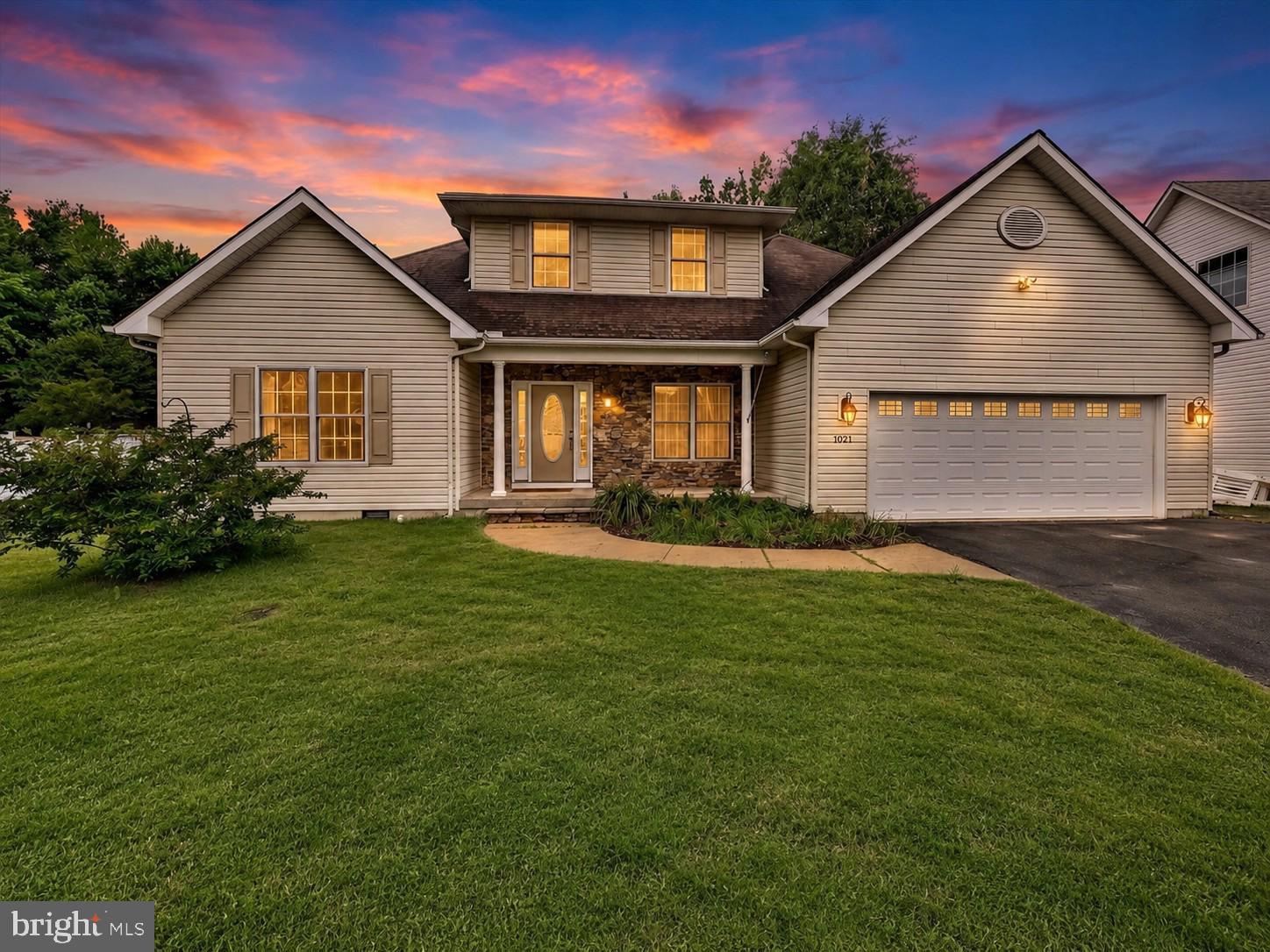 Experience the best of Eastern Shore living at 1024 Avalon Court, where spacious design, natural light, and a peaceful setting come together beautifully. Perfectly positioned on a desirable lot with views of the community pond area and protected woodlands, this exceptional residence offers a wonderful blend of privacy, comfort, and everyday convenience. From the inviting exterior with stone accents and a two car garage to the open interior layout and exceptional outdoor living spaces, this home is designed for easy living and effortless entertaining.

Step inside to a welcoming foyer with neutral paint and a bright, airy feel that continues throughout the main level. The thoughtfully designed floor plan offers excellent flexibility with formal living and dining areas, generous open gathering spaces, and seamless flow between rooms. Expansive windows bring in beautiful natural light while framing peaceful rear views, creating a warm and inviting atmosphere throughout the home.

The heart of the home is the open concept kitchen and family room area, ideal for both everyday living and entertaining. The kitchen features abundant cabinetry, granite counters, stainless steel appliances, recessed lighting, a center island cooktop, and direct connection to the surrounding living spaces. The spacious family room offers a cozy fireplace and easy access to the private screened porch and large raised concrete patio, two standout features rarely found in this community. Both outdoor spaces overlook the community pond area and protected woodlands, creating a private and peaceful backdrop for relaxing, dining, and entertaining.

The home continues with spacious bedrooms, including a large main level owner’s suite with generous closet space and a private bath featuring dual vanities, a soaking tub, and separate shower. This main level suite offers excellent flexibility for multigenerational living, guests, or those seeking everyday convenience. Additional bedrooms on the upper level provide comfortable space for family, guests, home office needs, hobbies, or recreation.

Outdoor living is truly a highlight, with multiple areas to enjoy the serene wooded setting. The private screened porch is perfect for morning coffee, quiet evenings, or relaxing without the elements, while the oversized raised concrete patio offers wonderful space for grilling, entertaining, or simply enjoying the peaceful rear views.

Additional highlights include flexible living spaces, a heated and air conditioned two car garage with amazing storage, and a peaceful rear setting rarely found in such a convenient location. Ideally positioned with easy access to major commuter routes including Routes 50 and 301, this exceptional residence offers convenient access to Downtown Annapolis, Washington, D.C., Baltimore, Kent Island, the Bay Bridge, Middletown, Dover, NSA, Fort Meade and Dover Air Force Base. Enjoy great local amenities including restaurants, shopping, recreation, and all the lifestyle conveniences that make the Eastern Shore so desirable. Don’t miss out on this incredible opportunity!