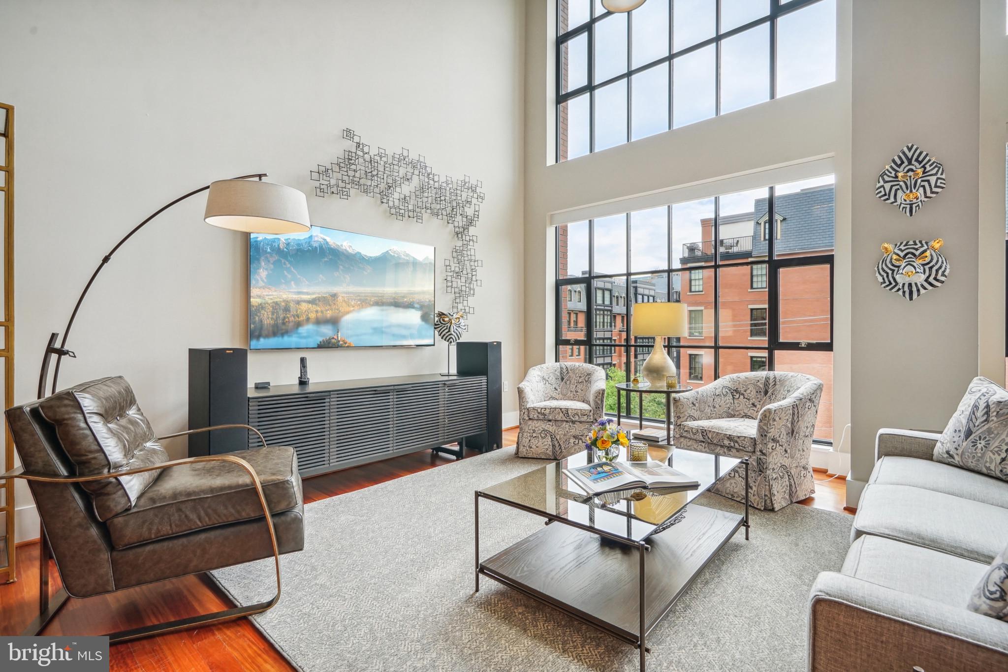 Unique Opportunity at Wooster & Mercer Lofts Experience luxury living in this recently remodeled 2,170-square-foot loft condo, a rare offering in the exclusive Wooster & Mercer Lofts. 

This stunning home features: 
• Abundant Natural Light & Modern Design: A two-story wall of windows floods the space with natural light, featuring contemporary exposed ductwork and a striking floating iron staircase to the second level. • Generous Living Space: Includes 2 bedrooms, 2.5 bathrooms, and a versatile loft area, ideal for a home office. 
• Sophisticated Finishes: Brazilian cherry hardwood floors throughout, fully renovated bathrooms, and an updated gourmet kitchen with Wolf and Sub-Zero stainless-steel appliances and granite countertops - perfect for entertaining. 
• Ample Storage and Parking: A walk-in pantry, two deeded parking spaces, and a large, humidity-controlled, well-lit storage unit with built-in shelving. 
• Recent Upgrades: Two new Carrier air conditioner units (2022) and two new Carrier furnace units (2023). 
• Convenience: Elevator access to the second, loft level. Building Amenities: •
 On-Site Community Manager 
• Swimming Pool & Sun Terrace 
• Central Courtyard 
• Fitness Center 
• Club Room 
• Secure Underground Parking & Bicycle Storage Condo fees cover, among other things, gas (heating and cooking), hot and cold-water utilities, and high-speed internet. 

Prime Location: 
• Convenient Access: Close to Metro stations, restaurants, grocery stores, pharmacies, US post office, and Georgetown shopping and dining. Public transportation options and short driving distances also make accessing these amenities easy and convenient. 
• Excellent Connectivity: Easy access to highways US-50, I-66, and I-495 beltway, and less than 4 miles to Washington National Airport. Don’t miss this rare chance to own an incredible loft in one of Washington's most sought-after locations.