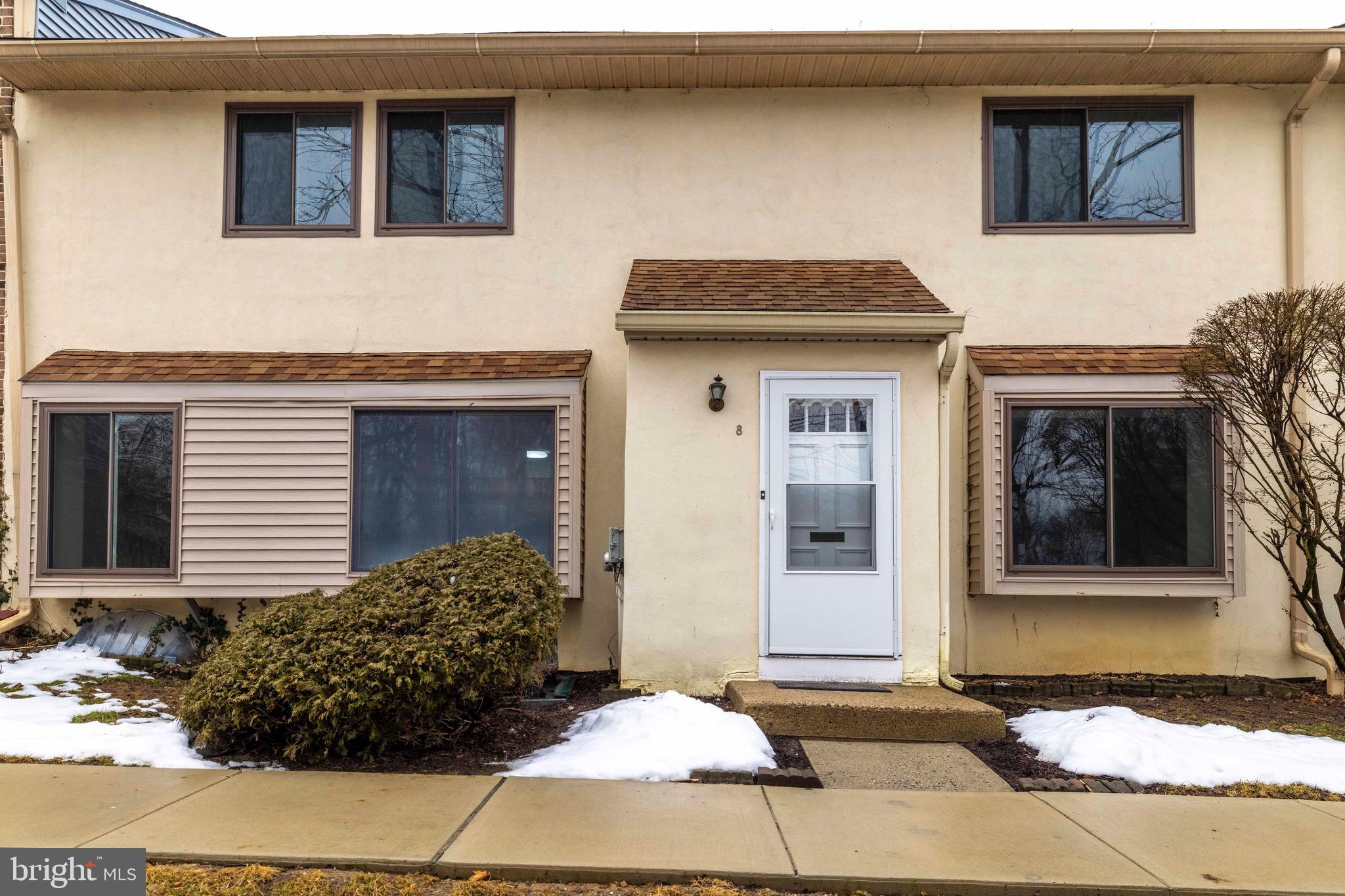 Welcome to one of the larger townhome units that is thoughtfully designed, featuring 3 bedrooms, 2.5 bathrooms,  a den and finished basement -   with 1,468-square-feet and nestled in the desirable International Village in Upper Moreland Township.  A welcoming foyer with a coat closet greets you upon entry, leading to a bright and airy living room featuring two large front windows that fill the space with natural light. The adjoining dining area, also enhanced by two large windows, creates an elegant yet cozy atmosphere for gatherings and everyday meals.  The main level also offers a versatile den/office with window - perfect for working from home or creating a quiet retreat - along with a convenient powder room. The kitchen is both functional and inviting, featuring granite countertops, an electric range, microwave, disposal, refrigerator and built-in desk space. A dedicated laundry area with washer and dryer adds everyday ease.  Beautiful hardwood flooring flows throughout the foyer, dining area, kitchen and den, while brand-new carpeting enhances the living room, staircase, second-floor hallway, primary bedroom and two additional bedrooms.  The spacious primary suite offers a large window, 2 closets and a private bath, complete with tub/shower combination. Two additional bedrooms provide flexibility for family, guests, or additional workspace. A hall bath with a tub/shower combination and dual-sink vanity, along with multiple hallway closets, ensures comfort and convenience for all.  The finished basement expands your living space — ideal for a recreation room, media area, or home gym — and includes an additional unfinished storage room plus utility room with work bench.  Additional features include brand-new electric (domestic) hot water heater, forced hot air heating with central air conditioning, replacement windows throughout and new storm door.  This property has been freshly painted throughout.  Residents of International Village enjoy exceptional value, with the condo fee covering exterior building maintenance, lawn care, snow removal, trash removal, water, common area maintenance, parking lots, and a community playground.  This lovely townhome offers the perfect blend of space, functionality and low-maintenance living — all in a beautifully maintained and welcoming community.  Close to SEPTA commuter line, major roads, the PA Turnpike, community parks, plenty of shopping, local restaurants and much more.  Schedule a showing today!