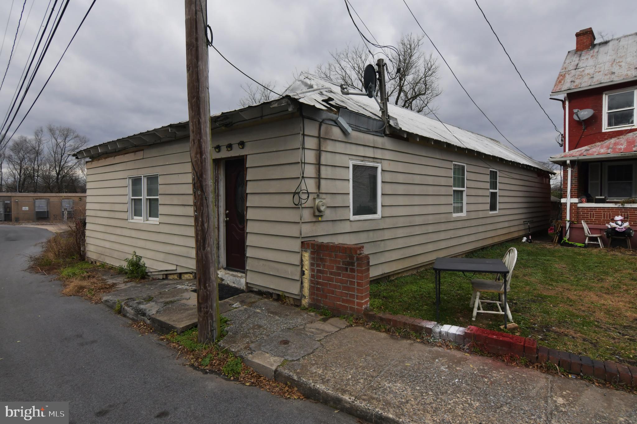 ONE-LEVEL LIVING WITH 3 BEDROOMS AND 2 FULL BATHS. GREAT OPPORTUNITY IN DOWNTOWN MARTINSBURG. EXCELLENT RENOVATION PROJECT FOR FLIPPERS AND OTHERS WHO ARE WILLING TO ROLL UP THEIR SLEEVES AND GET TO WORK. Sold strictly as-is, where-is. Cash only. This is one of six houses in various stages of interior demo/reno being offered for sale by this owner.  Four building lots also are for sale. The Eastern Panhandle is one of the fastest growing areas of West Virginia. Residents of Martinsburg and Berkeley County are attracted to the small-town atmosphere, employment opportunities, restaurants, shopping, services, medical facilities, a revitalizing downtown, and access to major roads I-81, Rt. 9 and Rt. 11, the MARC train and Amtrack. Lot sizes are approximate. Buyer to verify natural gas availability.  Cash only - proof of funds required.