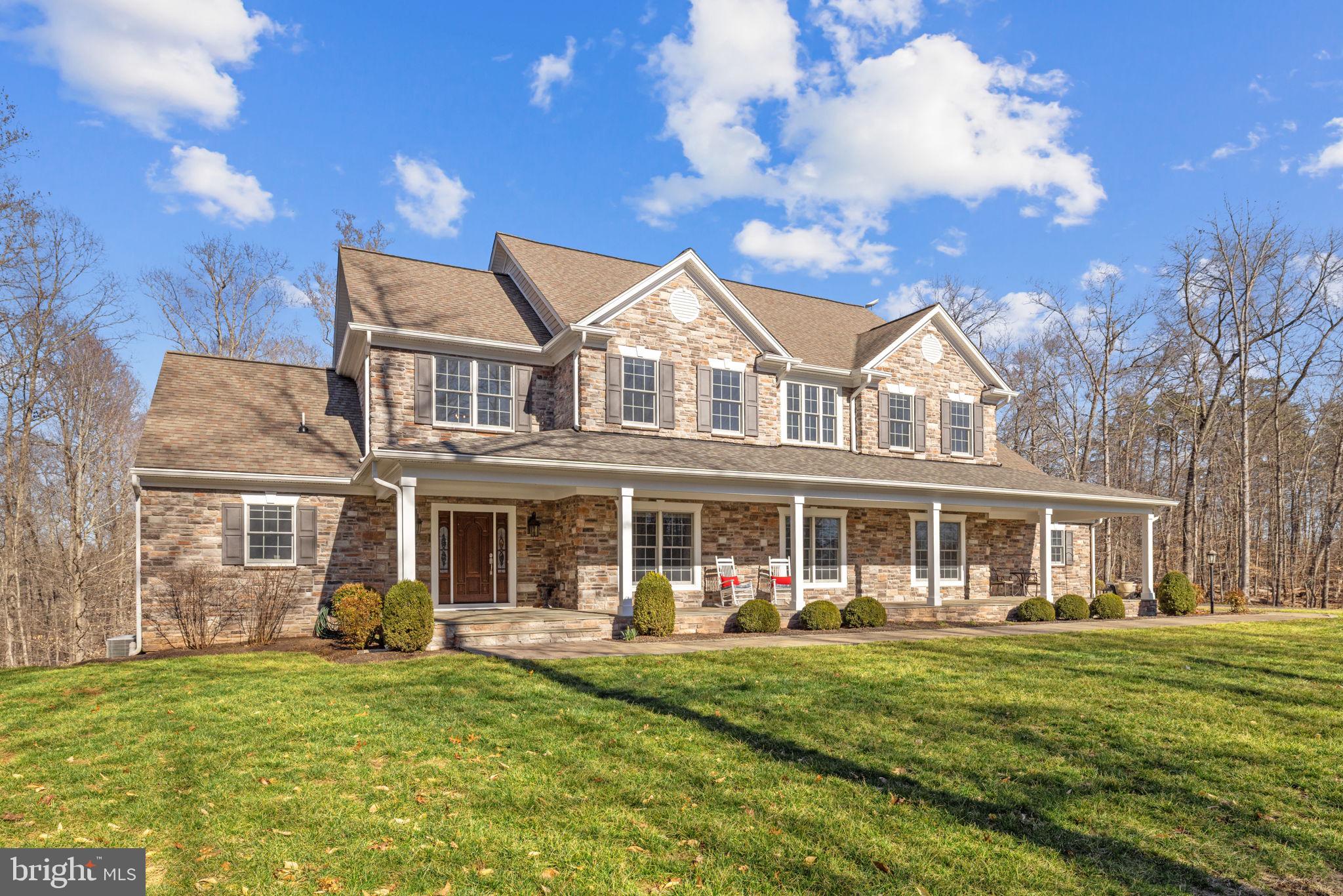 This substantial country estate offers the most supreme privacy in an area of thousands of acres of protected conservation land.  If your first choice is privacy, it doesn't get any better than this.  Situated on 78 acres, one drives through the impressive stone entrance, and a long, paved driveway takes you through your very own open countryside, through a row of trees, and again to open pasture.  After passing the impressive stable the drive winds up to a parklike setting and, completing the long-drive approach, to a particularly fine country house built to exacting specifications.  Built of stone and Hardie Plank, and approximately 6,500 sq. ft., the home features 10' ceilings.  Enter the manor-sized entry reception hall and your first glance features an elegant "good-morning" staircase.  Off the reception hall is a den with bookshelves, a full bath, and a bright sunroom.  It also leads into a large gathering room with massive pub beams and fireplace and then on into a sizeable, formal dining room.  A fully-fitted kitchen and a light-filled breakfast room looks out into the forest.  Beyond the oversized pantry, there is a spacious laundry room, a place for boots and coats, that leads to garaging for three cars equipped with automatic doors.  
Up the "good-morning" staircase leads to a comfortable sitting/piano room looking down into the entrance.  Follow an extra-wide hallway and one finds the primary suite with well-proportioned accommodations that include a lounge, bath, bed chamber, sunny sitting spaces and a king-sized walk-in closet.  Two other bedrooms, with 2 double closets each and a Jack and Jill bath complete this level.
Down the staircase to the lower level, one finds a TV area, a bedroom, full bath, and a first class, very spacious media/recreation room with lots of windows with remote control shades and a bar arrangement.  It opens to a stone patio.
From here it is a short walk to the stable with double doors at both ends, two stalls with space for others, a wash rack, 1/2 bath and laundry area.   Upstairs there is a multi-purpose area possibly for an exercise room, farm office, home business or lounge area, with full bath and features a deck with lovely views.
If you like a leisurely stroll or morning ride, there are what seems to be endless lovely, wooded trails for exercise or relaxation.  You can almost walk all day without leaving your own property, and the emphasis here is on privacy.  It's own little world with wildlife, bird watching and fresh country air.   There are homes nearby but none to be seen from your large, stone front porch.
This immaculate country home is located close to the historic, much-favored hamlet of Casanova, featuring a tiny, charming, U.S. post office, the ancient Weston House on the National Register, the 275 acre Weston Wildlife Conservation Site and the well-known Poplar Springs Resort and Spa.   
There is a partial-house generator and a small, fenced kitchen garden, 1000-gallon buried propane tank that conveys.   A security system.  Starlink equipment in the house conveys.  Stable is wired for Starlink but no equipment conveys.  Verify square footage and dimensions.   Dining room drapes do not convey.  Eleven closets.  Subject property in the Land Use tax program.