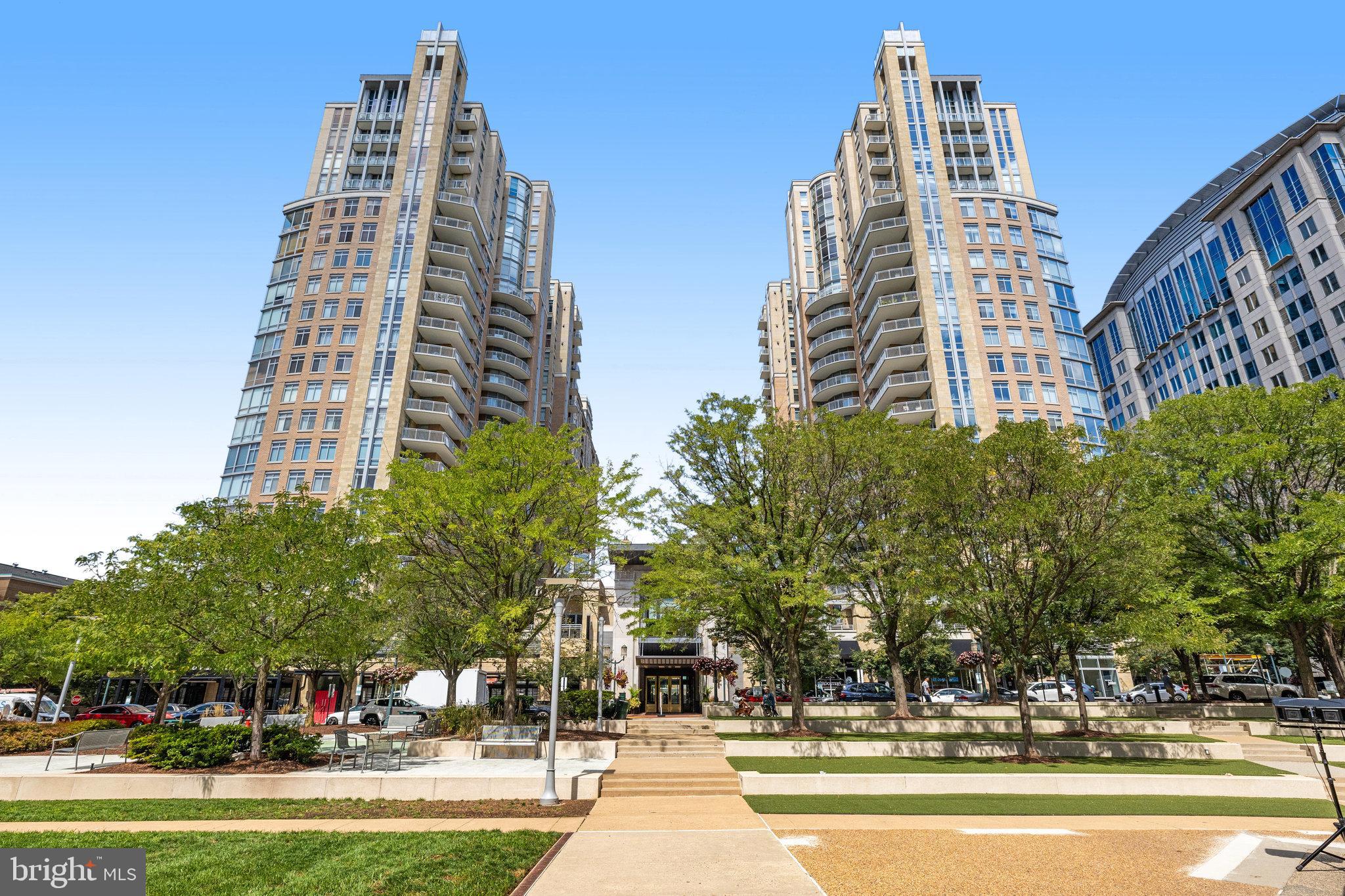 Experience Elevated Living in the Heart of Reston Town Center 

Discover a lifestyle of comfort and sophistication in this 3-bedroom, 2-bathroom condo at Midtown at Reston Town Center. Designed for effortless living and entertaining, the open-concept floor plan creates a spacious and inviting atmosphere, enhanced by breathtaking views of Sugarloaf Mountain through sweeping floor-to-ceiling windows. The gourmet kitchen is a chef’s dream, featuring upgraded cabinetry, granite countertops, under-cabinet lighting, a pantry, and stainless-steel appliances. The adjoining family room offers a perfect space to unwind while enjoying the urban skyline.

The primary suite is a serene retreat with a spa-inspired ensuite bathroom featuring double sinks, a jetted soaking tub, a separate frameless glass shower, and a walk-in closet. The second bedroom also includes a walk-in closet, while the third bedroom or home office is conveniently located off the living room. Recent updates include new carpet in two bedrooms (February 2025), fresh paint throughout (December 2024), an HVAC replacement (September 2020), and a refrigerator replacement (August 2018). Added conveniences include two deeded parking spaces (4043 & 4044) on G4 near the elevator and a deeded storage unit (SS1 in Storage Room 1) on the same level. 

Midtown’s resort-style amenities elevate everyday living with 24/7 concierge service, on-site management, a library, a conference room, a private movie theater, a state-of-the-art fitness center, an outdoor pool with a hot tub, a party room with a catering kitchen, two patio grilling areas, and two guest suites for visiting friends and family. Step outside and immerse yourself in Reston Town Center’s premier lifestyle, with fine dining, shopping, entertainment, a skating rink, concerts, and the W&OD trail just moments away. Effortless commuting is at your fingertips with the Reston Town Center Metrorail Station, public transit, and Dulles International Airport nearby.

For added peace of mind, the seller offers a one-year home warranty through Cinch Home Services. Don’t miss this rare opportunity to own an exclusive Midtown condo—where convenience, elegance, and urban vibrancy meet. Schedule your private tour today!