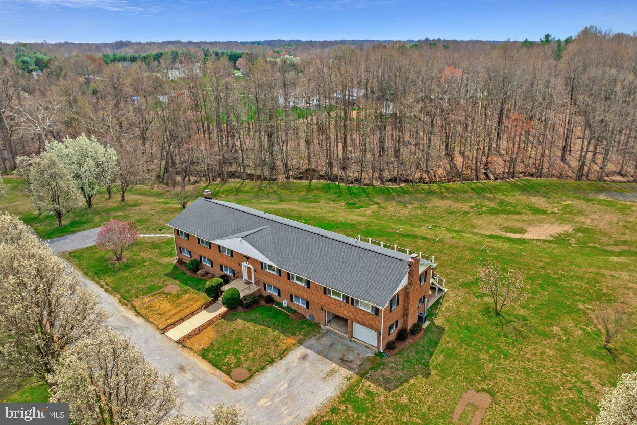 Location, location, location. Set in sought-after Owings, MD, this exceptional property offers the rare combination of space, flexibility, and convenience with an easy route in and out of Calvert County while still enjoying the peace and privacy of country living.

This stunning home has been completely renovated, featuring brand-new flooring, a modern kitchen, and beautifully updated bathrooms. Whether you are looking for a place to call home, a multigenerational living setup, an investment opportunity, or flexible space to fit your needs, the possibilities here are remarkable.  Bring your horses and livestock!  Build your own barn! 

The lower level is perfectly set up for an in-law living arrangement with its own separate kitchen, or it could offer rental potential, subject to local regulations. From extended living to additional income possibilities, this home offers versatility that is hard to find.

Situated on an expansive 9.65-acre lot, the property provides plenty of room to enjoy the outdoors, garden, expand, or simply take in the surrounding nature. With no homeowners association, you have the freedom to truly make the property your own. Recent updates include a roof that is only four years old, an eight-year-old well pump, and a brand-new Trex deck that creates the perfect outdoor space for relaxing or entertaining.  Home also has Anderson windows and sliders. For those cold nights you can warm up next to the wood burning fireplaces- one is located on the main level in the family room and the other is in the basement.

Inside, the home offers a warm and inviting atmosphere with thoughtfully designed spaces that make everyday living and hosting feel effortless. With extensive renovations, a flexible layout, and nearly ten acres of land, this property presents a unique opportunity for those looking for space, versatility, and convenience all in one place. Photos may be virtually staged.