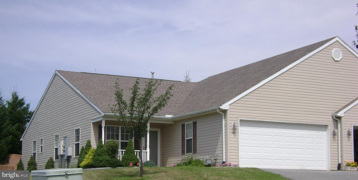 Ranch style condo in Equine Meadows,  a highly desirable 55+ community.  Covered front porch and concrete patio in back. Once inside, you will find over 1500 sqft. Large living room/dining room combo with overhead lighting and ceiling fans.  Living room access to the 2-car garage. The kitchen is open at both ends. Kitchen also features a pull-up breakfast bar, recessed lights, and a walk-in pantry. Family room is a wonderful sitting area with access to rear patio. Master bedroom has a walk-in closet and its own bathroom.  Roomy second bath.. Main bathroom has tub and shower with laundry.  These units are very heard to find! Don't miss out!