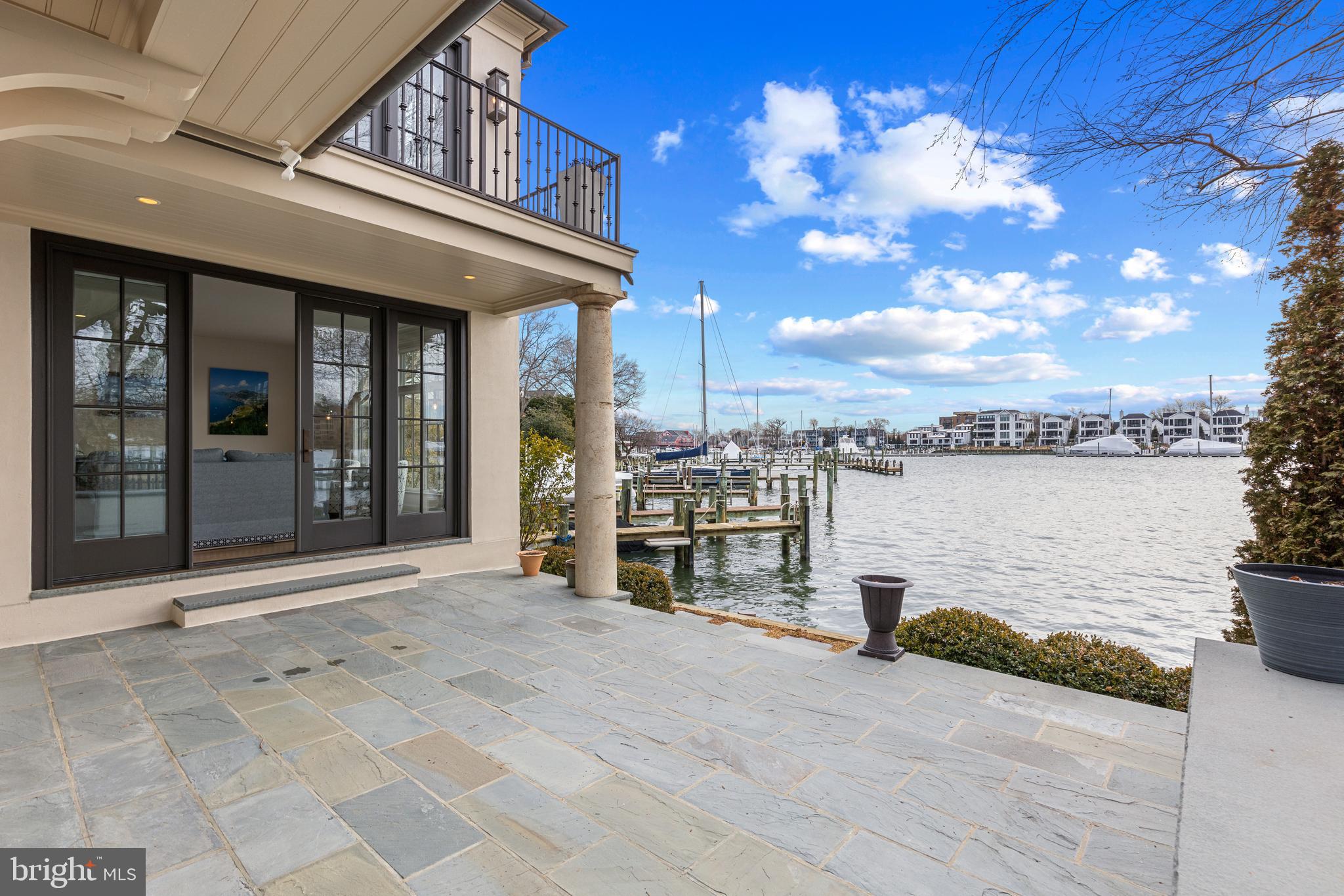 Stately French Villa on Spa Creek in downtown Annapolis! This jewel box of a home was designed and built by a renowned local architect as the culmination of an award-winning career. 

Offered completely turn-key, this exceptional residence conveys fully furnished and thoughtfully appointed—including furniture, fully equipped kitchen, linens, etc —allowing you to arrive with nothing more than a suitcase and begin enjoying the Annapolis waterfront lifestyle from day one. 

The unrivaled architectural detail, exquisitely curated finishes, and sweeping views across Spa Creek elevate this residence into a class of its own. Privately positioned at the end of a quiet street within one of downtown’s most coveted waterfront enclaves, this 3-bedroom, 3.5-bath retreat is equally suited as an elegant weekend escape or a full-time residence.

Dramatic Palladian windows bathe the interiors in natural light while perfectly framing the ever-changing harbor views. At the heart of the home, the gourmet kitchen—appointed with custom cabinetry, premium appliances, and a striking designer hood—flows seamlessly into both the formal living room and inviting family room, each enhanced by a gas fireplace and captivating water vistas. A main-level secondary primary suite offers comfort and flexibility for guests of all generations.

Upstairs, the extraordinary waterside primary suite features vaulted ceilings, walls of glass, a gas fireplace, spa-inspired bath with soaking tub, and a custom dressing room with center island. A private balcony provides the ideal perch for sunrise coffee or sunset reflections overlooking Spa Creek, Annapolis Harbor, and Eastport.

Designed for effortless waterfront living, two deep-water piers with approximately 9 feet of MLW accommodate substantial vessels, with immediate access to the Severn River, the Chesapeake Bay, and beyond.  Walkable to the shops, restaurants, and charm of downtown, this rare offering delivers convenience, privacy, elegance, and ease in one remarkable package. Welcome Home!