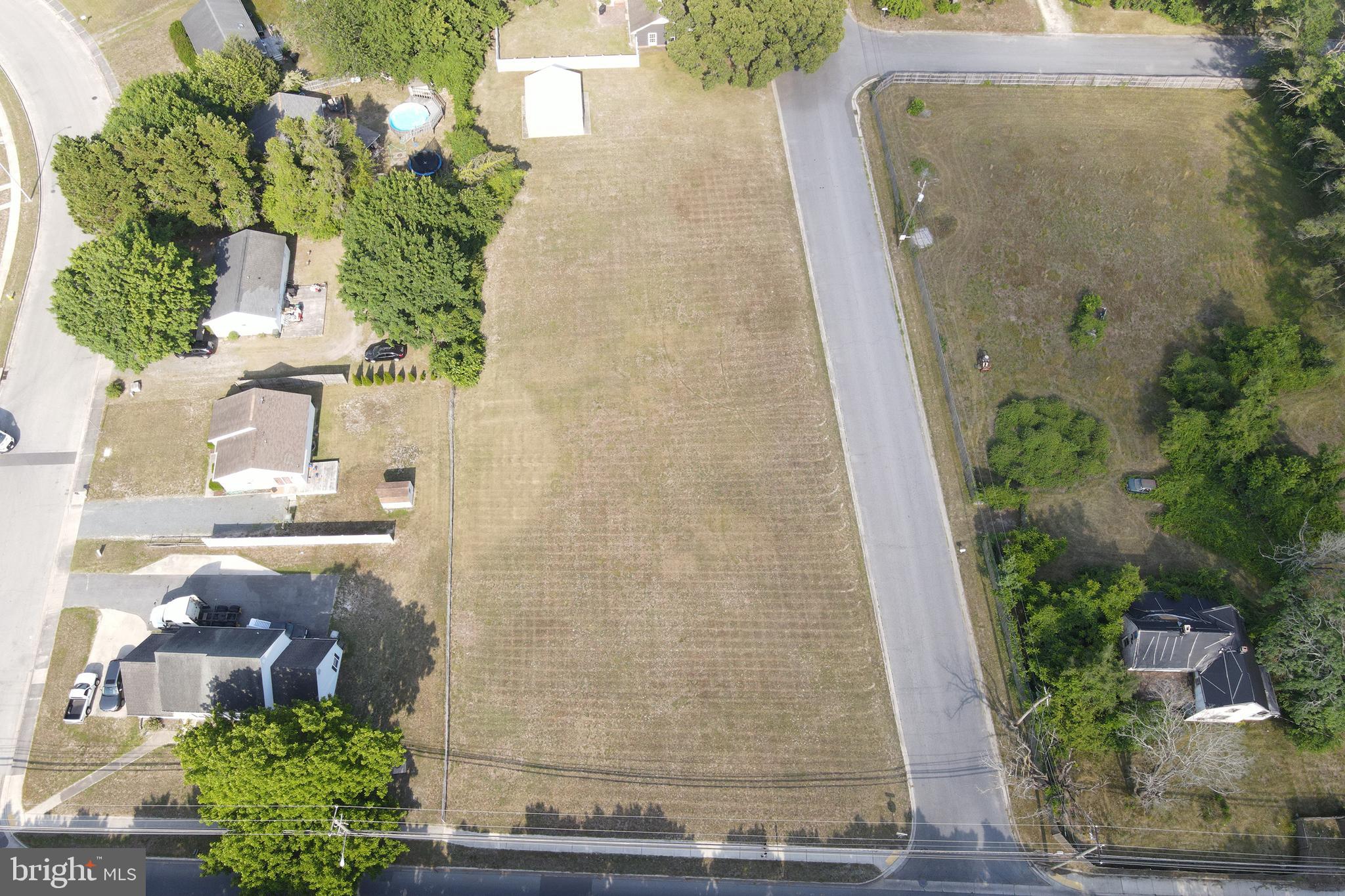 Rare investment opportunity in a prime Salisbury location! Two combined parcels totaling 1.1 acres, ideally positioned adjacent to Salisbury University's Sea Gull Stadium. One of the area's highest-traffic corridors. Zoned R8A within the City of Salisbury, this site offers strong development potential with a walkable connection to the University campus, making it well-suited for student housing, multi-family, or mixed-use development. Situated on the corner of South Division Street & Hall Drive, the property includes a 26' x 24' x 10' steel frame building at the rear, adding immediate utility or storage value during the entitlement process.  Don't miss this opportunity to secure a high-visibility, university-adjacent parcel in one of the Eastern Shore's most active markets!