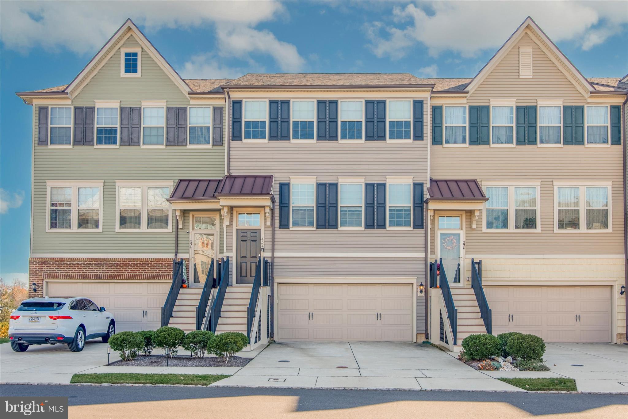Welcome to this stunning 3-bedroom, 2.2-bathroom townhome in Tall Oaks! Step inside and be greeted by the dark hardwood floors on the first floor stairs and landing. The main living area features beautiful LVP flooring, large living/dining room with triple windows allowing the natural light to pour in.  The upgraded gourmet kitchen boasts brand new S/S appliances, 42-inch maple glazed cabinets, granite countertops, pantry and an amazing center island. Enjoy a sun-filled breakfast or your morning coffee on your private deck overlooking open space. The second level primary suite features a beautiful tray ceiling with recessed lighting and walk-in closet.  The primary bath with an extended double vanity, granite countertops, frameless shower w/ bench and custom tile. There are two additional nice size bedrooms, a full bath with tub/shower and laundry room. The finished lower level offers a walkout to a large patio. This will be great space for a family room, home office, gym or entertaining friends. A power room and access to the 2 car garage with storage area complete this level. Conveniently located for all of your commuting needs, regional rail, Rt 95 and all other major routes. There are an abundance of shopping centers, wonderful dining options and a short drive to Doylestown. Don't miss out on this incredible opportunity to own this beautiful home. This property is being sold AS IS condition.