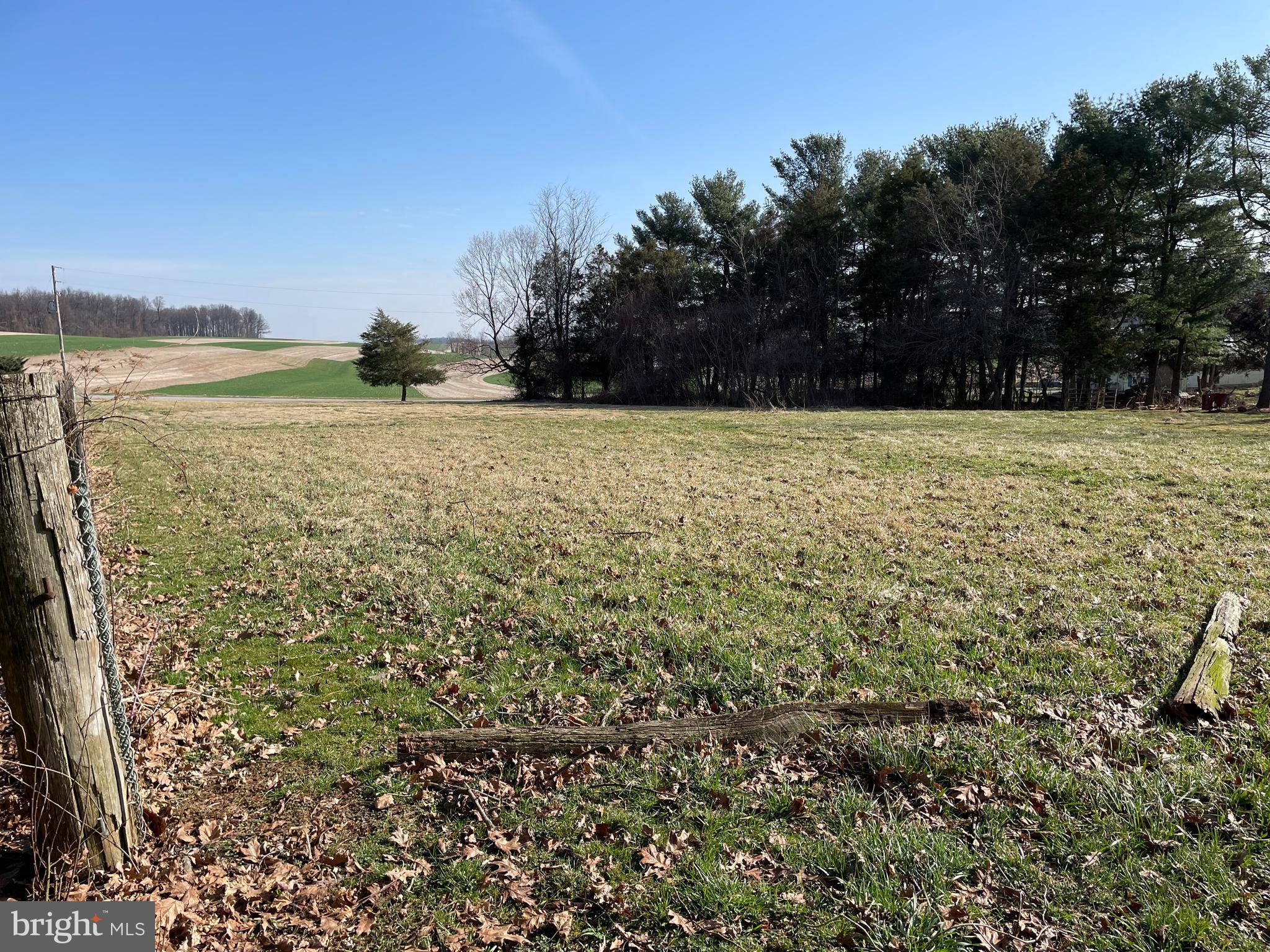Picturesque 1.16 acres in Southeastern School District. Views of fields. Land is a level field with a strip of trees and a 40' x 25' barn. Lot has approved PERC test. The owner had animals years ago. Check with township to confirm if animals are still allowed. Access from Hyson School Rd.