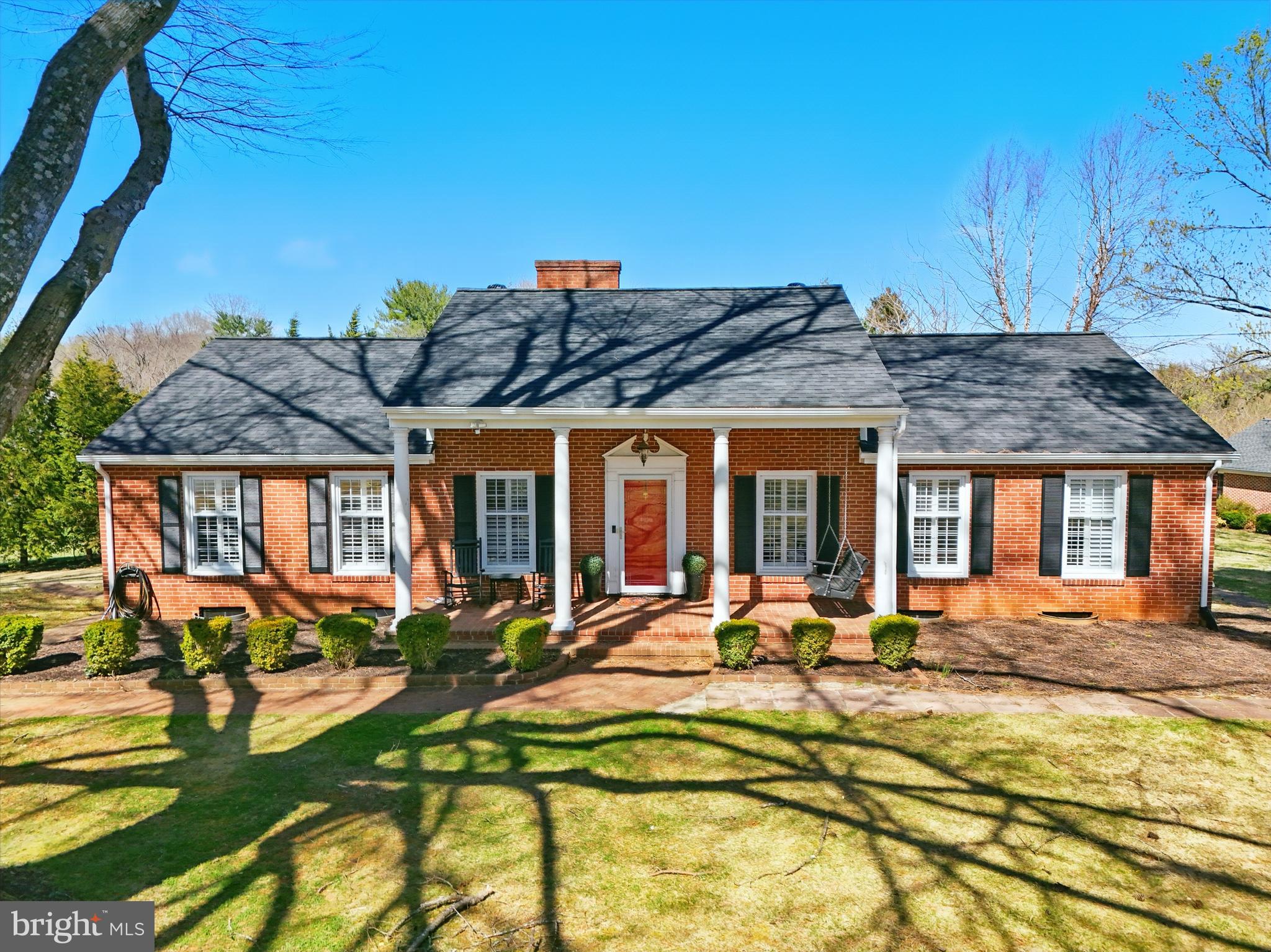 Orange County Virginia is the Epitome of beautiful small-town America!  Located in the heart of the Piedmont, with rolling landscapes and views of the Blue Ridge Mountains, this little community is the perfect place to escape the hustle and bustle of life yet convenient to Charlottesville, Fredericksburg and Culpeper. 

 This charming brick rambler provides main level living inside of the town limits on a spacious .87 acre lot with NO HOA!  This solidly built home features a new roof, tasteful lighting, color choices and hardwood flooring.  The lower level gives added living space with a kitchenette and spacious rec room, complete with the second gas fireplace.  The paved circular driveway adds to the stately curb appeal.  This corner lot offers plenty of space for gardening, outdoor living, pets and room to run.   Two sheds convey for all of your outdoor tools and storage.  Enjoy the peace and quiet from the inviting front porch or from the privacy of the back yard on the new patio!   If you are not interested in cookie cutter homes, come see the quality of this all brick classic!