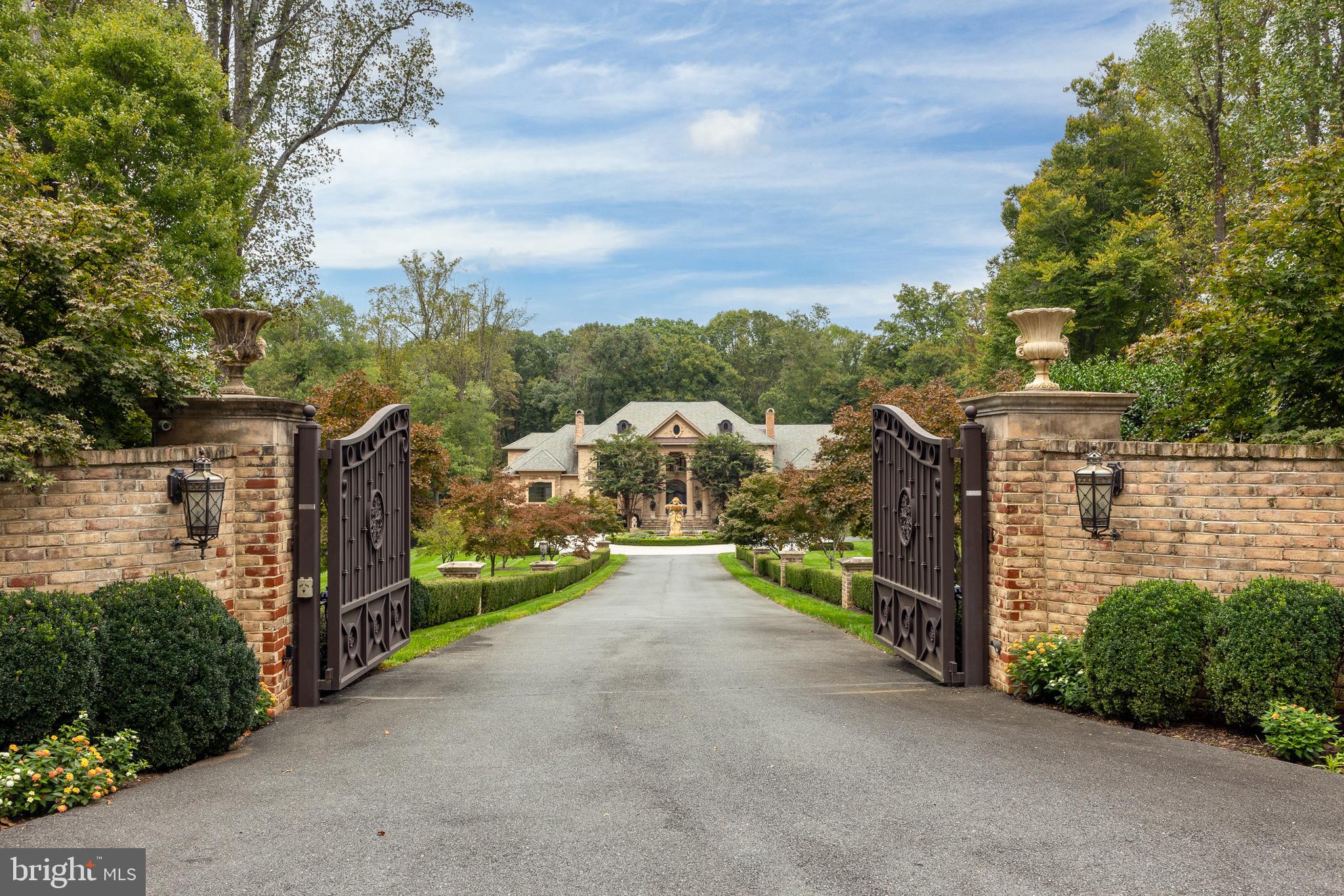 This is one of the finest homes on the market, set on a breathtakingly elegant property. Initially constructed in 2012 by a most celebrated builder, The Building Group, the home underwent a significant renovation in 2023, enhancing its opulence with a perfectly balanced modernism. The scale is delightful, so every room is arranged most comfortably. There is an abundance of space that creates open contemporary spaces without sacrificing properly formal living and entertaining rooms. The all-new kitchen and adjacent family room are calling for the latest review from Architectural Digest; the materials and total aesthetic are timeless yet modern and create one of the warmest gathering places in the entire home.  This home gives a consistent feeling on every level and with every amenity. The primary suite commands an entire wing of the main level, with soaring ceilings, a romantic sitting area beneath the grand windows, unbelievable dressing rooms, and a brand-new white marble primary bathroom. More amenities include the home theater room, a full bar, wine cellar, billiards room, fitness room, sauna, and a full lower-level walk-out to the impressive outdoor living spaces. The swimming pool and surrounding pool decks, outside fireplace, and rich landscapes are pure havens for relaxation. The five acres offer beautiful plantings of flowers and trees, a private apple orchard, and the most impressive reveal for the home, passing through the front gate down a regal approach to the circular driveway anchored by a gorgeous sculptural water fountain. When you visit the home, feelings of joy and awe are certain; please come prepared to fall in love.