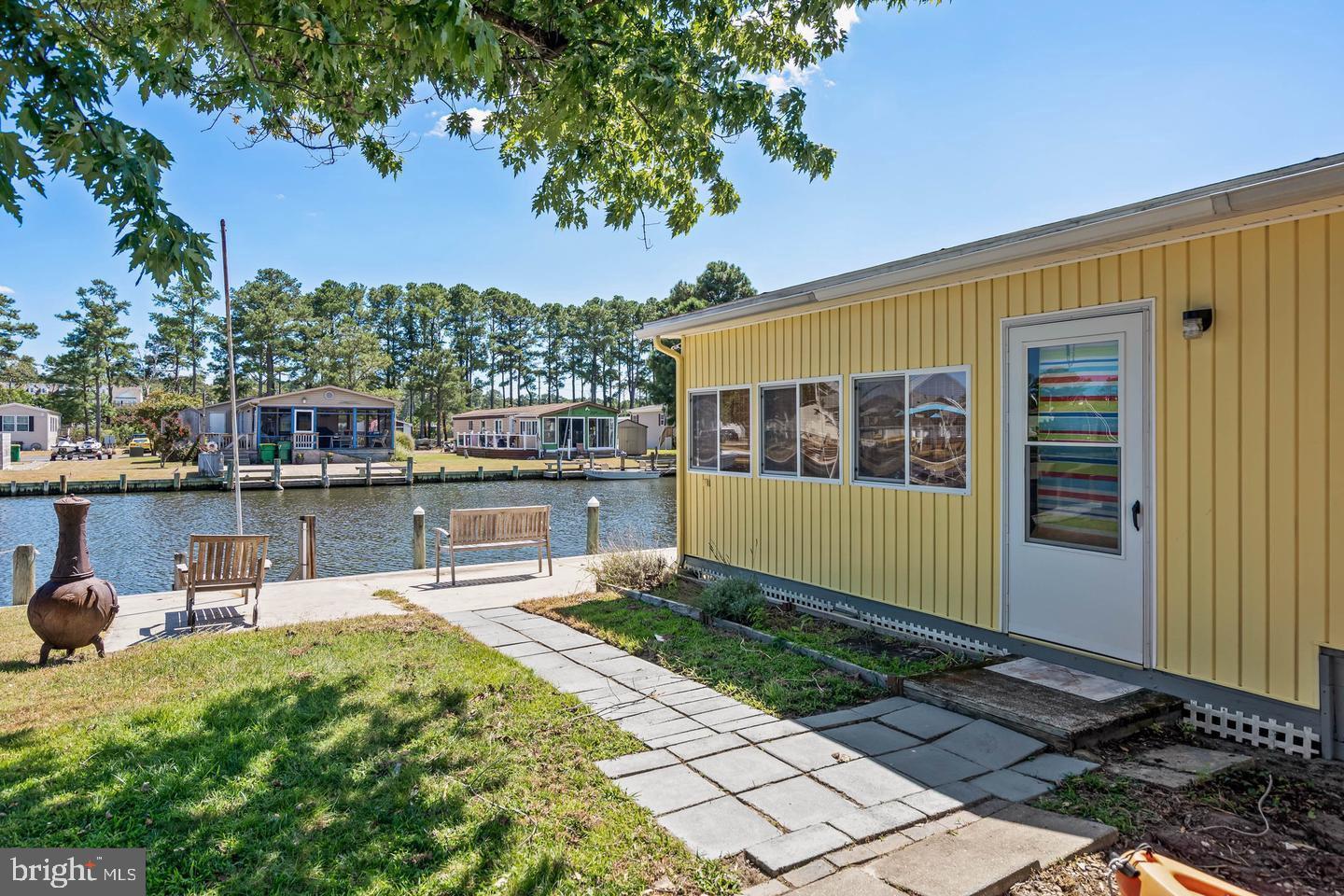 Welcome to waterfront living at its finest! This spacious 3-bedroom, 2-bath home offers the perfect blend of comfort, functionality, and coastal charm in Mariners Cove. 

Step inside to discover an open-concept floor plan designed for easy living and entertaining. The large living room flows seamlessly into the dining area, creating a bright and inviting space with beautiful water views. A versatile family room provides additional space for relaxing, hosting guests, or creating a home office.

The thoughtfully designed kitchen offers ample cabinetry and storage, while additional storage throughout the home ensures plenty of room for all your belongings.

Outside, you’ll find a generously sized lot with paved parking for up to four vehicles. Boating enthusiasts will love the private dock and dedicated boat slip, providing direct access to the water right from your backyard. Whether you’re enjoying your morning coffee overlooking the water, spending the day on the boat, or entertaining family and friends, this property offers the waterfront lifestyle you’ve been dreaming of.

Don’t miss this rare opportunity to own a waterfront retreat with space, convenience, and endless possibilities. 
Contingent on park approval. Property being sold as-is.
Lot Rent: $1,200/month.