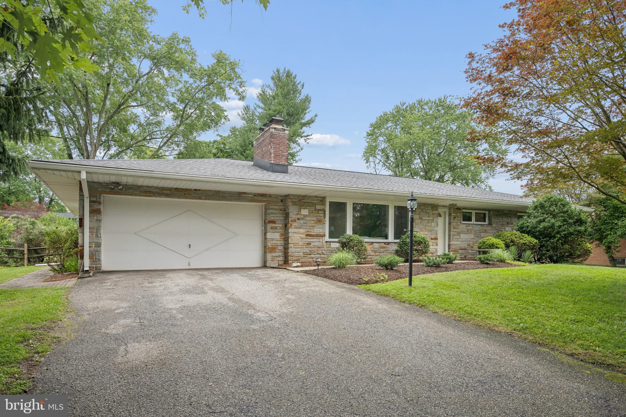 Welcome to 9710 Hillsmere Road, a beautifully maintained stone-front rancher nestled on a premium lot in the highly sought-after Glen Brook community of Ellicott City. Offering over 2,900 square feet of finished living space, this spacious home features 3 bedrooms, 3 full bathrooms, timeless character, thoughtful updates, and the convenience of one-level living.

Step inside to discover red oak hardwood floors, fresh paint, replacement premium vinyl windows, and an updated kitchen that serves as the heart of the home, perfect for both everyday living and entertaining. The spacious primary bedroom offers a peaceful retreat with a beautifully renovated en-suite bathroom featuring a walk-in shower. Two additional generously sized bedrooms provide flexibility for family, guests, or a home office. A convenient main-level laundry room and a cozy wood-burning fireplace complete the inviting main level.

The finished lower level expands your living space with a large recreation area, a second wood-burning fireplace, a full bathroom, and endless possibilities for a guest suite, home gym, media room, or playroom.

Outside, enjoy the home's elevated setting, mature landscaping, and attractive stone façade that create exceptional curb appeal. The oversized two-car garage provides ample storage, while the roof was replaced in 2018, and the home's replacement vinyl windows provide improved energy efficiency and low-maintenance living.

Ideally located just minutes from shopping, dining, parks, and everyday conveniences, with quick access to Routes 40, 29, 100, and I-70, this home combines comfort, space, and an unbeatable location in one of Howard County's most desirable neighborhoods.

Don't miss your opportunity to make this Glen Brook gem your next home!