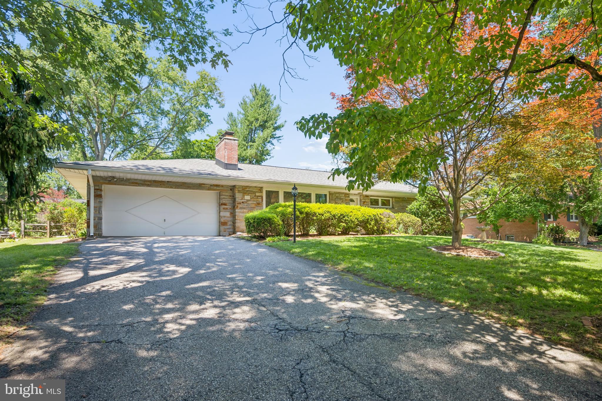 Welcome to 9710 Hillsmere Road, a beautifully maintained stone-front rancher nestled on a premium lot in the highly sought-after Glen Brook community of Ellicott City. Offering over 2,900 square feet of finished living space, this spacious home features 3 bedrooms, 3 full bathrooms, timeless character, thoughtful updates, and the convenience of one-level living.

Step inside to discover red oak hardwood floors, fresh paint, replacement premium vinyl windows, and an updated kitchen that serves as the heart of the home, perfect for both everyday living and entertaining. The spacious primary bedroom offers a peaceful retreat with a beautifully renovated en-suite bathroom featuring a walk-in shower. Two additional generously sized bedrooms provide flexibility for family, guests, or a home office. A convenient main-level laundry room and a cozy wood-burning fireplace complete the inviting main level.

The finished lower level expands your living space with a large recreation area, a second wood-burning fireplace, a full bathroom, and endless possibilities for a guest suite, home gym, media room, or playroom.

Outside, enjoy the home's elevated setting, mature landscaping, and attractive stone façade that create exceptional curb appeal. The oversized two-car garage provides ample storage, while the roof was replaced in 2018, and the home's replacement vinyl windows provide improved energy efficiency and low-maintenance living.

Ideally located just minutes from shopping, dining, parks, and everyday conveniences, with quick access to Routes 40, 29, 100, and I-70, this home combines comfort, space, and an unbeatable location in one of Howard County's most desirable neighborhoods.

Don't miss your opportunity to make this Glen Brook gem your next home!