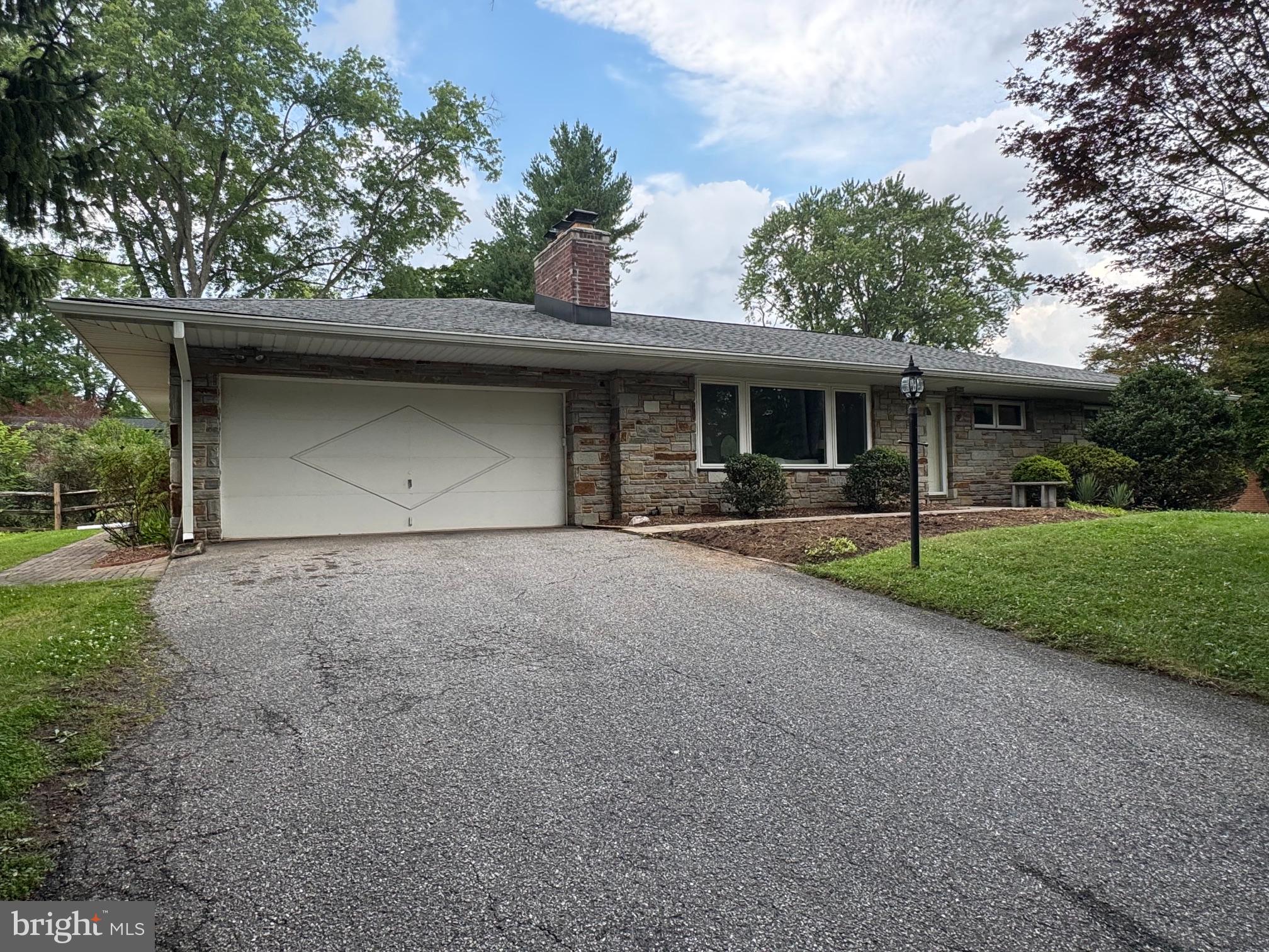 Welcome to 9710 Hillsmere Road, a beautifully maintained stone-front rancher nestled on a premium lot in the highly sought-after Glen Brook community of Ellicott City. Offering over 2,900 square feet of finished living space, this spacious home features 3 bedrooms, 3 full bathrooms, timeless character, thoughtful updates, and the convenience of one-level living.

Step inside to discover red oak hardwood floors, fresh paint, replacement premium vinyl windows, and an updated kitchen that serves as the heart of the home, perfect for both everyday living and entertaining. The spacious primary bedroom offers a peaceful retreat with a beautifully renovated en-suite bathroom featuring a walk-in shower. Two additional generously sized bedrooms provide flexibility for family, guests, or a home office. A convenient main-level laundry room and a cozy wood-burning fireplace complete the inviting main level.

The finished lower level expands your living space with a large recreation area, a second wood-burning fireplace, a full bathroom, and endless possibilities for a guest suite, home gym, media room, or playroom.

Outside, enjoy the home's elevated setting, mature landscaping, and attractive stone façade that create exceptional curb appeal. The oversized two-car garage provides ample storage, while the roof was replaced in 2018, and the home's replacement vinyl windows provide improved energy efficiency and low-maintenance living.

Ideally located just minutes from shopping, dining, parks, and everyday conveniences, with quick access to Routes 40, 29, 100, and I-70, this home combines comfort, space, and an unbeatable location in one of Howard County's most desirable neighborhoods.

Don't miss your opportunity to make this Glen Brook gem your next home!