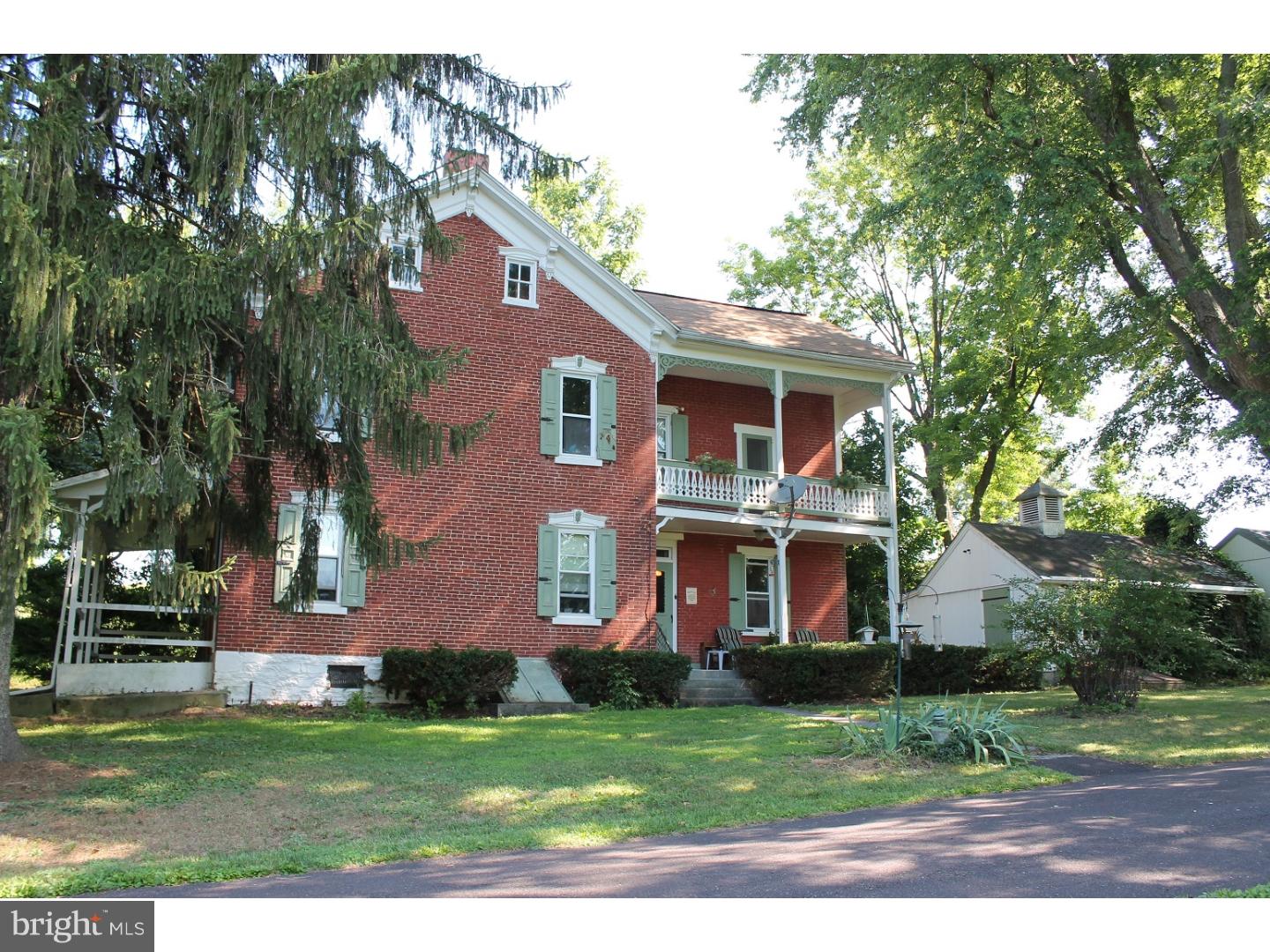 This Circa 1900 brick farm house is just what you are looking for! Nestled on 12.5 acres, this home has old world charm with modern updates. Classic wooden shutters and "gingerbread" exterior trim work accentuate the outside of the home. Step inside and you'll immediately notice the recent hardwood floors in the living, dining room and office. The "knock out" kitchen is every cooks dream with high end stainless steel appliances, custom maple cabinets, Corian counters, tile floors, and skylights. The first floor powder room is shared with the laundry. Upstairs offers a spacious full bath and 4 bedrooms. The master bedroom is complete with a full wall of closets and balcony... a perfect retreat for morning coffee and the newspaper and more. But wait, there's much more! Just a few steps away enjoy an amazing oasis- a 20'x48' inground swimming pool. Tons of concrete patio space and a gazebo and fire pit for entertaining. Additional outbuildings include a bake house, cold cellar, outhouse, and a 1 car garage with storage/shed area. Newer 2 zone furnace and hot water heater. Close to major routes for easy commutes to work or play.  Price includes adjacent parcel.
