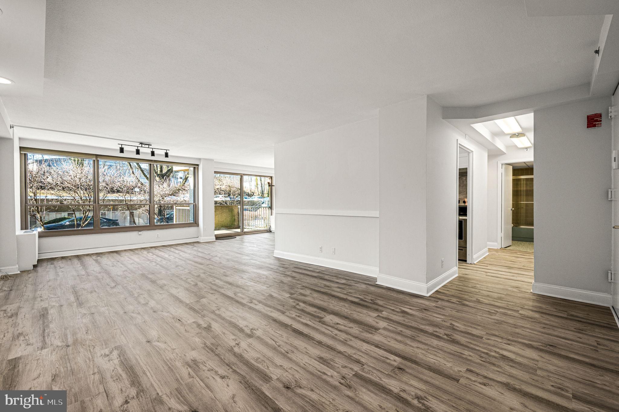Move right into this beautifully updated home in the west building featuring a new kitchen with stainless steel appliances, tile backsplash and granite countertops - perfect for both everyday living and entertainment. Fresh interior paint and new flooring throughout the entry, living room, dining area and both bedrooms create a clean, modern aesthetic. Thoughtful lighting upgrades include a new dining area chandelier, living room track lighting, and an overhead kitchen light, enhancing both style and functionality. The two spacious bedrooms feature new ceiling fans, a walk-in closet with shelving in one bedroom and two separate closet areas in the other. Additional value-added features include new ceilings in both full bathrooms, an upgraded electrical panel, and interior sprinkler system. Step outside from the dining area to a private patio—ideal for relaxing or outdoor dining. A laundry closet with a new washer and ventless dryer adds for everyday convenience. The three interior photos showing furniture are virtually staged and the original photos also provided. HOA fees include electricity, heat, air conditioning, hot and cold water, a security guard at the vehicle entrance, 24/7 doorman and basement storage locker. Residents also enjoy access to tennis courts, playground, game room, library and shuttle bus to local shopping, the train station and Lankenau Medical Center. Situated on a beautifully landscaped 23-acre property, the community offers outdoor and indoor pools, cabanas, parking garage, electric car charging station, fitness center, and social club (additional fees apply). It’s like a vacation right at your front door! There is a special assessment fee for common area improvements due in June 2026 of approximately $1,500 WHICH HAS ALREADY BEEN PAID BY THE CURRENT OWNER.  Located in the highly sought-after Lower Merion School District, the community is adjacent to Friends Central School and just a half mile north of the Kaiserman JCC. Wynnewood Shopping Center and Whole Foods are 1.5 miles west, while Trader Joe’s and the boutiques of Suburban Square are 2 miles west. City Avenue Shopping Center is less than 1 mile south. Center City Philadelphia is an easy 25-minute drive or take advantage of the Overbrook SEPTA R5 train station less than a half mile north for effortless commuting. This location is also ideal for professionals working at Lankenau Medical Center, located just around the corner. An exceptional value in an unbeatable location—don’t miss this opportunity!