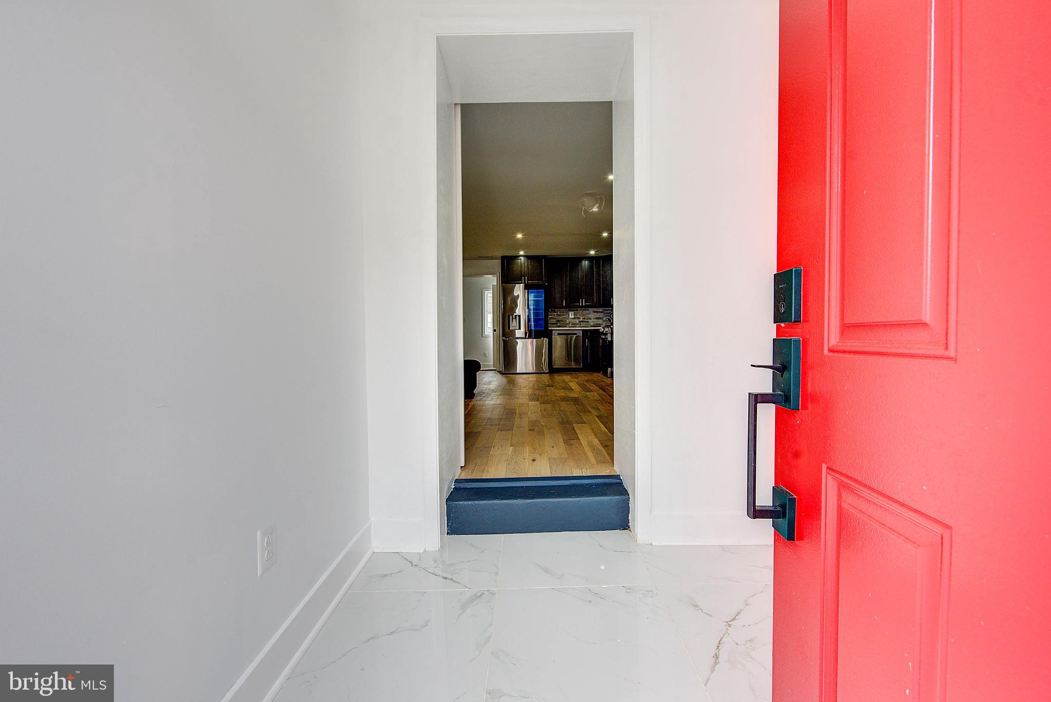 Welcome to this totally renovated two-bedroom, one-and-a-half bath townhouse that perfectly blends modern updates with warm, inviting style. From the moment you arrive, the manicured front yard and the bold red door create instant curb appeal, setting the tone for what awaits inside. Step through the entry into a welcoming foyer with a mudroom, the ideal drop zone before moving into the bright and airy living room. Gleaming hardwood floors flow throughout, leading to a dining area/eat-in kitchen designed for today’s lifestyle. The kitchen shines with granite countertops, sleek cabinetry, stainless steel appliances, and a gas stove, offering both function and contemporary flair with powder room in rear. Upstairs, you’ll find two comfortable bedrooms and a full bath, enhanced with new windows that flood the home with natural light. The finished basement provides versatile bonus space—perfect for a home office, gym, or cozy lounge—and includes a convenient half bath. Out back, enjoy a private adorable yard that’s just right for summer barbecues, gardening, or quiet relaxation. With thoughtful upgrades and stylish details throughout, this home is truly move-in ready Highlights: • 2 bedrooms, 1.5 baths • Hardwood floors throughout • Renovated kitchen with granite countertops & stainless-steel appliances • Finished basement • New windows & charming red front door • Manicured yard & welcoming front exterior

This home qualifies for special financing with Citizens Bank 3% down with no PMI.