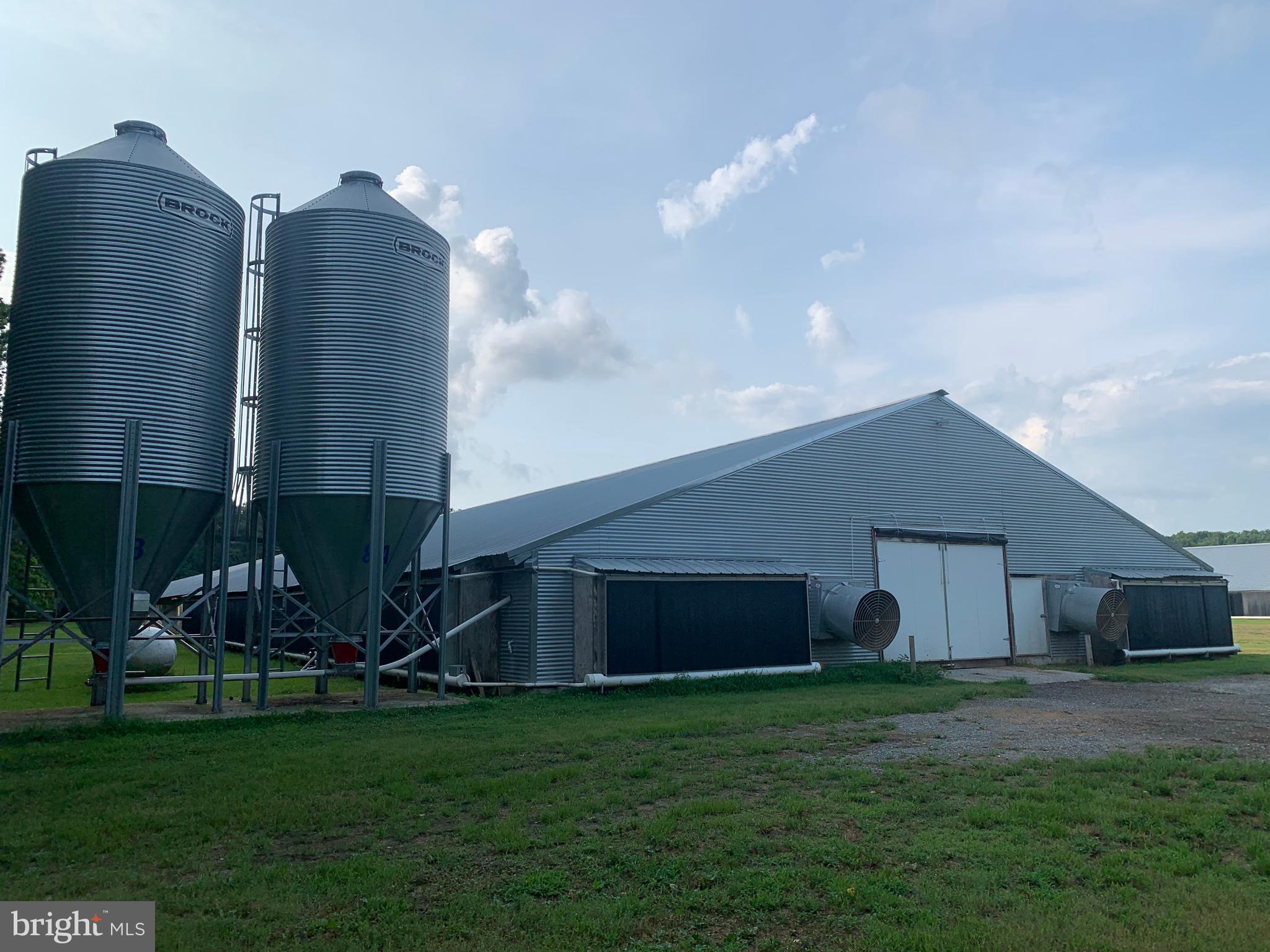 A very fine farm on 33 acres!  Five chicken houses:  60 x 560 built in 2012, 60 x 500 built in 2007/2008, and 3 - 40 x 560 built in 2000, offering 130,800 square feet.  There are 8 wells and 2 manure sheds and 3 existing pads where it should be possible to build three more chicken houses.  Well maintained and attractive 4-bedroom, two bathroom, home, with many renovations.  Great price for a farm this size, in this very good condition, with a very attractive home, and pads for three more chicken houses.