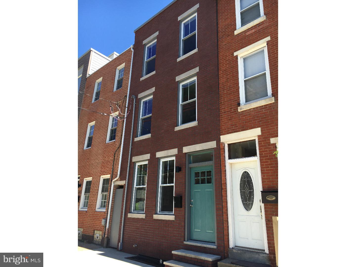 Welcome to this completely rehabbed, stunning 3BR 2.5 bath in the heart of Fishtown. Walking distance to Frankford Hall, Root, Pizza Brain & many more. Front of home has all new brick facade with painted lintels Enter into living room that features an open floor plan, with hard wood floors through out, 9 foot+ ceiling and an exposed brick wall in living room. Kitchen has granite counter tops with a breakfast bar, all new stainless steel appliances tons of cabinet space and a large pantry. Outside features a nice sized fenced in yard with an alley what that leads to the front of the houses. 2nd floor features a large bedroom with ceiling fan and ample closet space. 2nd bedroom has ceiling fan along with a balcony to enjoy those warm summer nights. There is a full 3 piece bathroom along with a stackable washer and dryer. 3rd floor is the magnificent master suite with it's own full bath, ceiling fan and 2 large walk-in closets along with access to the rooftop deck with stunning views of the city. There is a finished basement with half bathroom, tiled floors and recessed lighting. Other features include new HVAC, upgraded electrical and home is wired for WIFi control throughout.