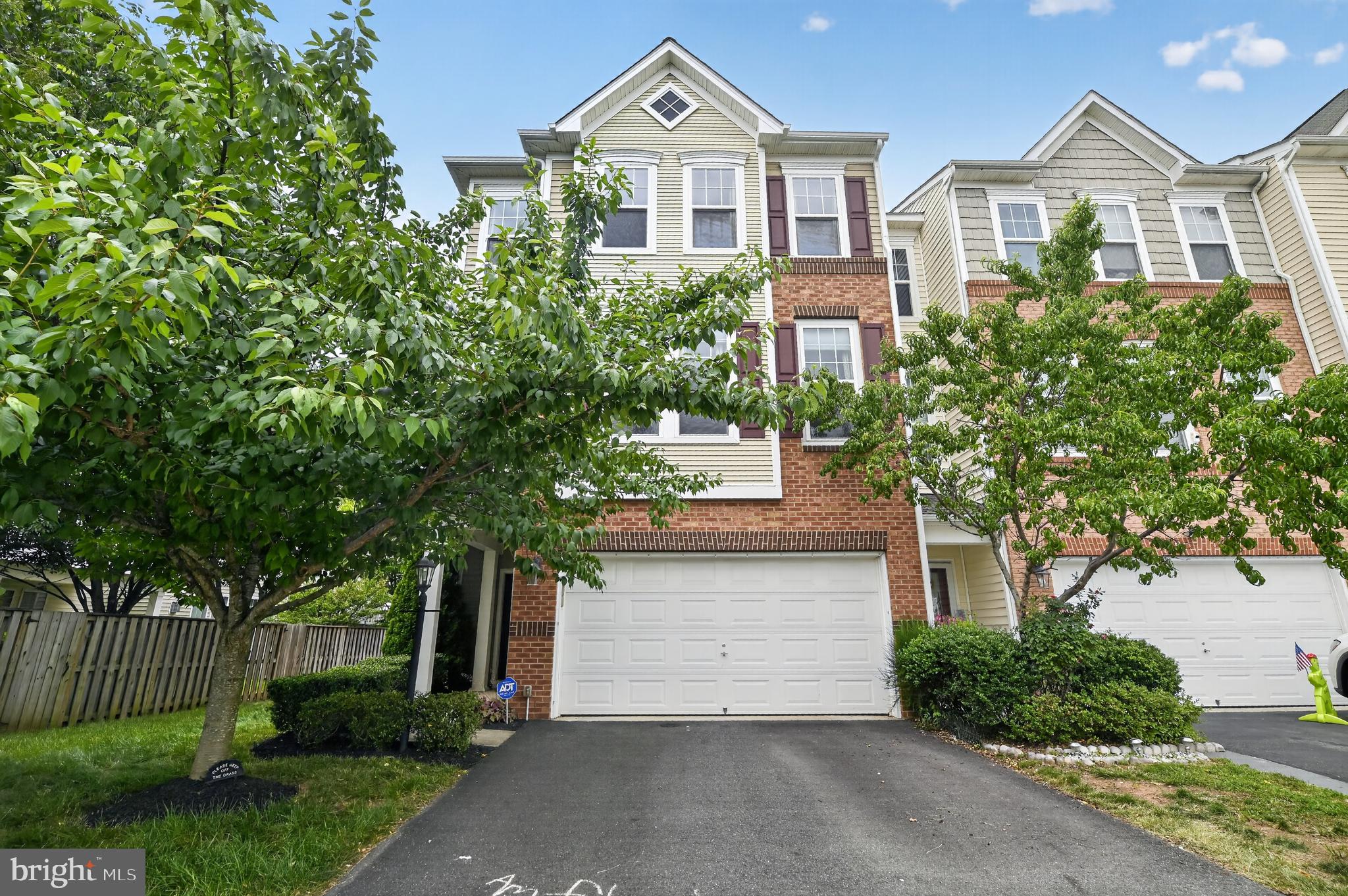 Nestled in the charming Stone Ridge community, this exquisite end unit townhouse embodies the perfect blend of elegance and comfort.  4 bedrooms and 2 full baths on upper level. Built in 2013, this Colonial-style residence boasts a stunning brick front that exudes timeless appeal. With 2,920 square feet of thoughtfully designed living space, this home is a sanctuary for those who appreciate high-end finishes and an exclusive lifestyle. Step inside to discover a warm and inviting atmosphere, highlighted by rich wood floors that flow seamlessly throughout the main level. The heart of the home is the gourmet kitchen, featuring a spacious island that invites culinary creativity. Walk to deck which steps down to patio and private fenced yard.  The main level also features a cozy fireplace, creating a focal point for gatherings and a perfect spot to unwind during cooler evenings. The open-concept design allows for effortless flow between the living and dining areas, making it ideal for both intimate dinners and larger celebrations. Retreat to the luxurious primary suite, where relaxation awaits.   The fully finished walkout basement offers additional living space, perfect for a media room, play area, or personal gym. With an outside entrance, it seamlessly connects to the outdoor space, enhancing the home's overall functionality. Enjoy the convenience of an attached two-car garage, providing both security and easy access. The community amenities include a refreshing pool, perfect for those warm summer days, fostering a sense of community and leisure. This property is not just a house; it's a place to create lasting memories. With its blend of luxury, comfort, and community, this townhouse is a rare find that promises an exceptional living experience. Embrace the lifestyle you've always dreamed of in this stunning home.