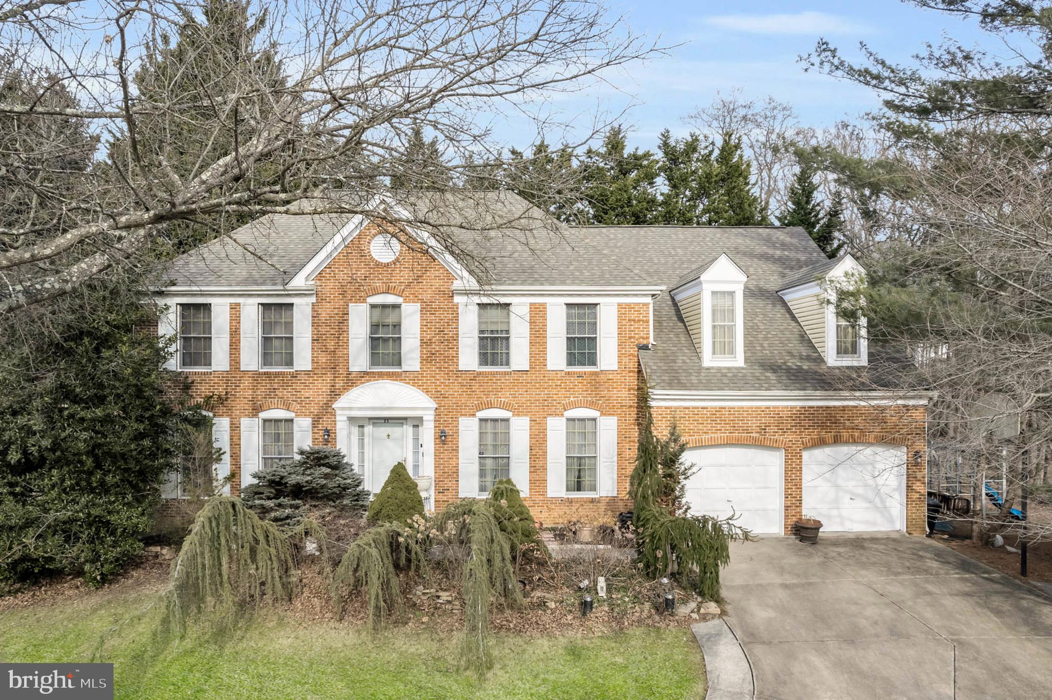 Welcome to 23 Cotswold Court, a stunning and spacious 4-bedroom, 3.5-bathroom Colonial home nestled in the charming community of Owings Mills. This residence seamlessly blends elegance and functionality, offering an exceptional living experience for those seeking comfort and style.  New Roof & Siding 2018 / New HVAC both units replaced in 2020 / New Hot Water Heater 2024.

As you cross the threshold, you are immediately greeted by a grand 2-story foyer with granite flooring and a curved staircase that exudes sophistication. To the left, the Living Room and Study offer versatile spaces for relaxation or productivity. On the right, the Formal Dining Room provides a perfect setting for hosting dinner parties or family gatherings.

The heart of the home is the expansive Great Room, where the soaring 11-foot vaulted ceiling and skylights create an open and airy atmosphere. Gleaming hardwood floors run throughout the room, and the brick wood-burning fireplace serves as the centerpiece, flanked by two graceful arched windows that let in plenty of natural light.

Adjacent to the Great Room is the Gourmet Kitchen, a chef's dream, offering ceramic tile floors, granite countertops, and an array of premium features. A center island with gas cooking provides ample space for meal prep, while the double wall oven is ideal for cooking large meals. The kitchen also includes a Butler’s Pantry and a cozy Breakfast Room, perfect for casual dining.

A half bath and a laundry room round out the main level of the home, adding to the convenience and functionality of this beautiful layout.

Upstairs, the sleeping quarters are all generously sized. The Primary Suite is a luxurious retreat, featuring a spacious sitting room, hardwood floors, and a vaulted ceiling that enhances the sense of space. A walk-in closet provides plenty of storage, while the luxury en-suite full bath is a true spa-like experience. The bath features a Jacuzzi jetted tub, a double-sink vanity, skylights, and an oversized walk-in shower for ultimate relaxation.

In addition to the Primary Suite, the upper level includes three more well-sized bedrooms. One of the bedrooms is accompanied by an en-suite full bath, offering added privacy and convenience for guests or family members. The lower-level in unfinished, ready for your own specifications...there is a rough-in for a full bath.

The rear two-tiered deck backs up to serene woods, creating a peaceful outdoor retreat. Whether you're hosting a summer barbecue, enjoying a morning cup of coffee, or simply relaxing with nature, this outdoor space offers both beauty and privacy. The professionally landscaped and maintained yard is framed by mature trees and shrubs, and in the spring and summer months, you will be greeted by colorful and fragrant blooms, adding to the home's curb appeal and charm.

This home at 23 Cotswold Court offers an unparalleled lifestyle, combining luxurious living spaces, high-end finishes, and an ideal location in a friendly community. It’s the perfect home for those who appreciate elegance, comfort, and natural beauty.