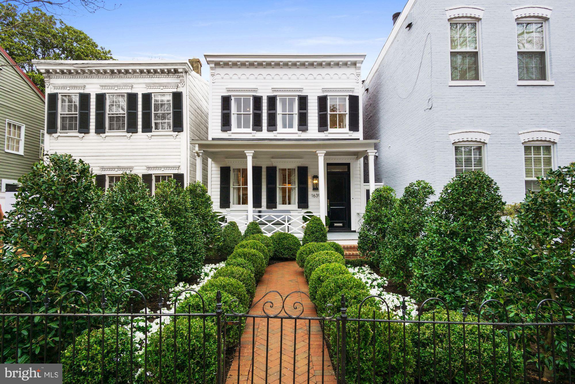 Akseizer Residential does it again with this immaculate Georgetown renovation. A fully-detached colonial home circa 1908 has been reimagined for modern living with no detail spared. The lush gated garden with herringbone brick walkway leads to a charming covered front porch and into an expansive parlor. White oak herringbone wood floors flow throughout the open living space including the Living Room with a marble gas fireplace flanked by custom built-ins, Dining Room, and eat-in Kitchen with waterfall edge island, top-of-the-line Thermador appliances, Waterworks fixtures, and walkout to a professionally-landscaped private rear garden. 4 Bedrooms offer generous storage, and 3.5 Bathrooms feature gorgeous Waterworks fixtures and marble finishes. Added convenience with laundry on both the upper and lower levels. Smart home features include wifi-connected integrated audio, video, lighting, thermostats, security, appliances, and more. All complete with gated parking in a prime Georgetown location.