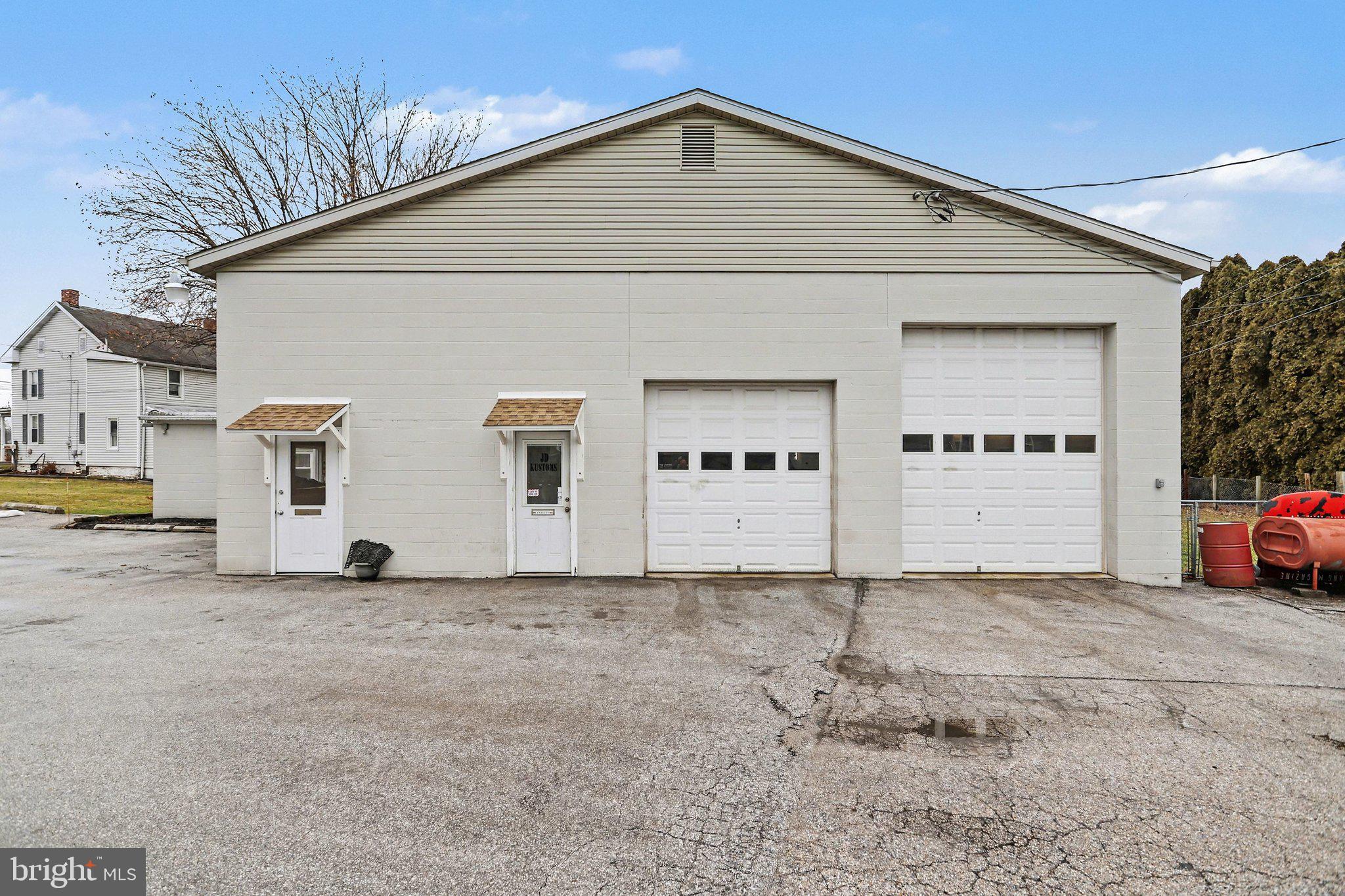 Opportunity awaits with this commercial garage located in the heart of Hanover, PA! This 2,505 sq. ft. turn-key property features two large service bays with ample space for repairs, inspections, or specialty automotive work, a welcoming receptionist and customer waiting room, a separate office, ample parking for employees and customers, and prime road frontage in downtown Hanover. Recent upgrades include a new furnace and a/c unit installed in 2021, a new hot water heater in 2024, and a new roof just installed in 2025, all offering peace of mind for years to come. Numerous items convey with this well-equipped garage including two lifts, a hydraulic press, a spring compressor, a transmission jack, a welder, floor jacks, work benches, furniture, electronics, appliances, a security system, and so much more. Don't miss this fantastic opportunity for your new or expanding business! Schedule your tour today!