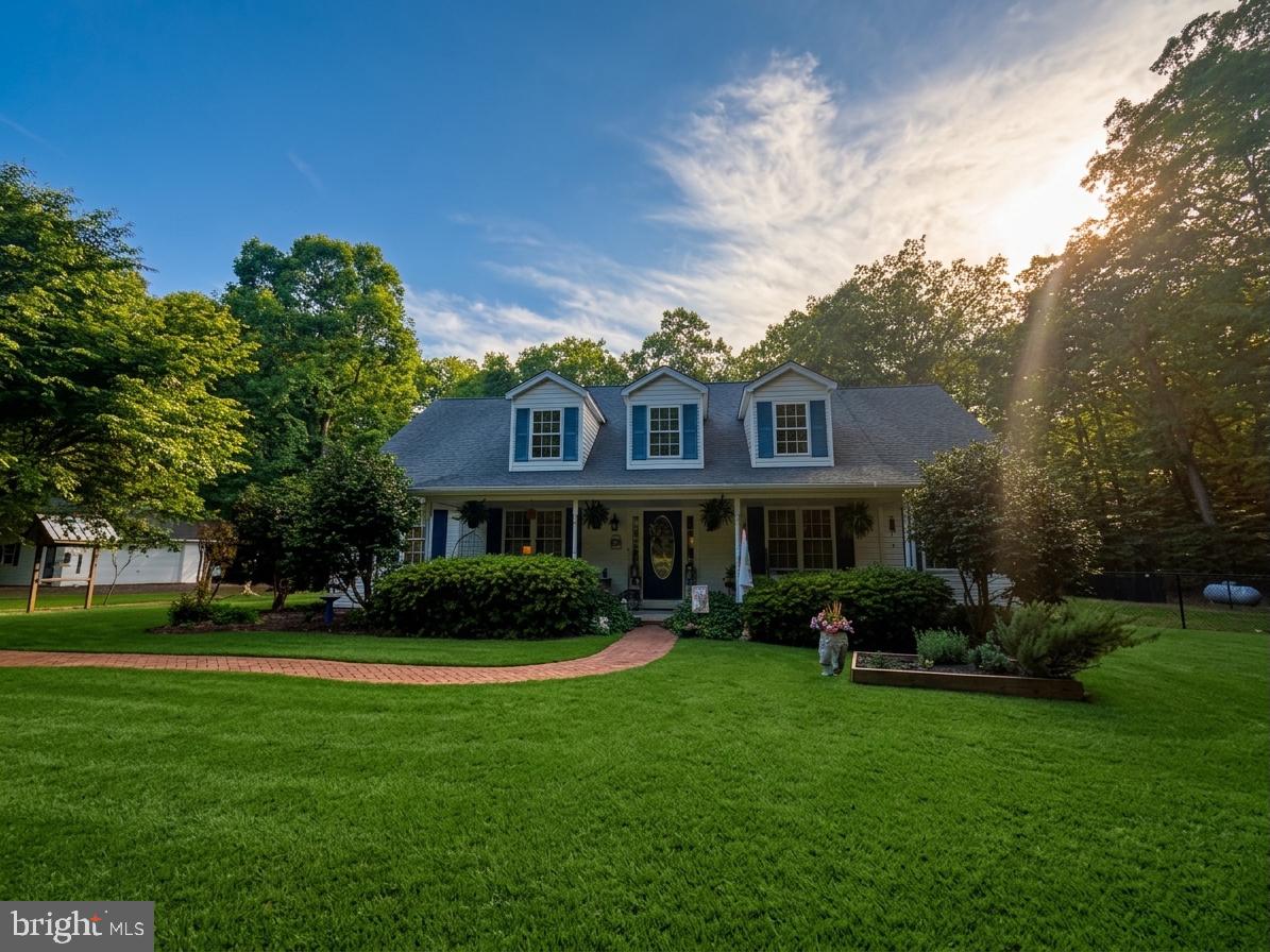 Welcome to a rare offering in the heart of historic Newburg, Maryland.  Where timeless Southern charm, peaceful countryside living, and thoughtful craftsmanship come together in perfect harmony. Offered for sale for the very first time, this custom-built residence is far more than a home; it is a place filled with intention, tradition, and treasured memories. So beloved was the floor plan by the current owners, they chose to build it twice.  A true testament to the home’s warmth, functionality, and enduring design.

Privately tucked away on approximately 3.5 secluded acres, this remarkable property is accessed by a private drive and surrounded by picturesque farmland, creating a setting that feels worlds away from the pace of everyday life. From the moment you arrive, the home welcomes you with the kind of understated elegance reminiscent of a Southern Living Magazine countryside retreat.   Inviting front porch, sweet tea afternoons, and tranquil views included, you’ll only need to bring your rocking chairs.

Inside, meticulous care and pride of ownership are evident in every inch of the home. Rich Brazilian cherry hardwood floors add warmth and sophistication throughout the main living areas, while oversized windows and dormers invite beautiful natural light into the home. The spacious main-level primary suite offers comfort and privacy, complete with an expansive en-suite bath featuring a jetted soaking tub, separate closets, and generous storage.

Designed with both entertaining and everyday comfort in mind, the home features a large living room centered around a cozy fireplace, creating the perfect gathering space for family and friends. Just beyond, the three-season sunroom overlooks the peaceful rear yard and offers a quiet escape to enjoy every season of Southern Maryland’s beauty.

The gourmet kitchen is ready for its next chef, appointed with granite countertops, stainless steel appliances, and a gas range that anchors the heart of the home with both style and function.

Upstairs, discover an expansive family recreation room or potential fourth bedroom complete with a full bath, upgraded plush carpeting and padding, ample storage, and charming dormers that bathe the space in natural light. Whether used as a guest retreat, media room, or private suite, the possibilities are endless.

Additional highlights include a recently updated heating system, fenced rear yard for your furry companions, garden areas, chicken coop space, detached garage and the kind of privacy that has become increasingly difficult to find.

Steeped in the quiet charm and rich history of Newburg — a treasured waterfront and farming community known for its scenic beauty and slower pace of life…this property offers the rare opportunity to own a true countryside retreat while still remaining conveniently accessible to modern amenities.
If you have been searching for a home with soul, substance, and a story to tell, this is the one you have been waiting for.