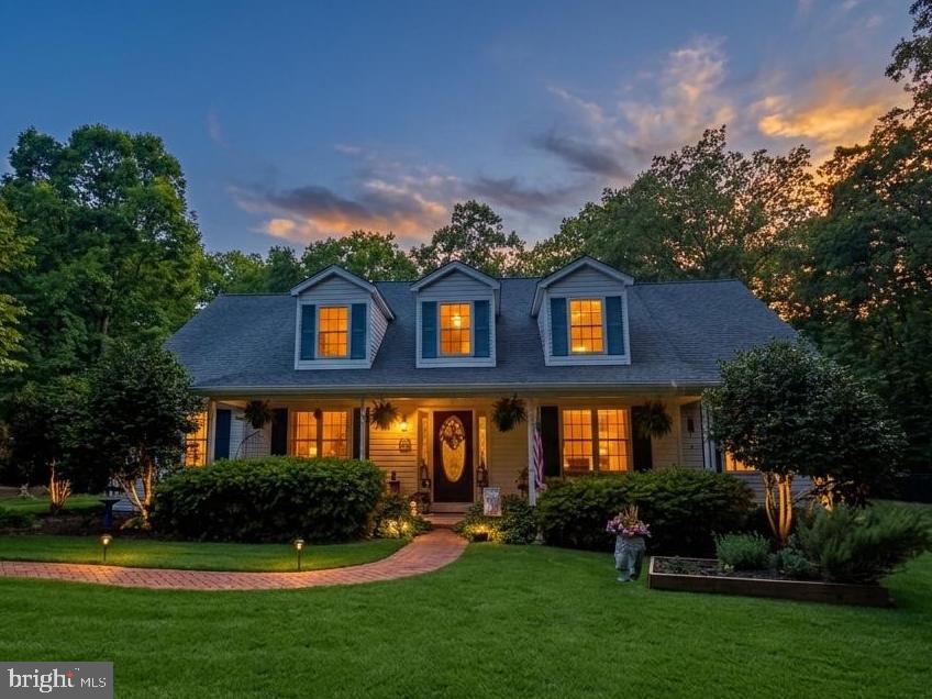 Welcome to a rare offering in the heart of historic Newburg, Maryland.  Where timeless Southern charm, peaceful countryside living, and thoughtful craftsmanship come together in perfect harmony. Offered for sale for the very first time, this custom-built residence is far more than a home; it is a place filled with intention, tradition, and treasured memories. So beloved was the floor plan by the current owners, they chose to build it twice.  A true testament to the home’s warmth, functionality, and enduring design.

Privately tucked away on approximately 3.5 secluded acres, this remarkable property is accessed by a private drive and surrounded by picturesque farmland, creating a setting that feels worlds away from the pace of everyday life. From the moment you arrive, the home welcomes you with the kind of understated elegance reminiscent of a Southern Living Magazine countryside retreat.   Inviting front porch, sweet tea afternoons, and tranquil views included, you’ll only need to bring your rocking chairs.

Inside, meticulous care and pride of ownership are evident in every inch of the home. Rich Brazilian cherry hardwood floors add warmth and sophistication throughout the main living areas, while oversized windows and dormers invite beautiful natural light into the home. The spacious main-level primary suite offers comfort and privacy, complete with an expansive en-suite bath featuring a jetted soaking tub, separate closets, and generous storage.

Designed with both entertaining and everyday comfort in mind, the home features a large living room centered around a cozy fireplace, creating the perfect gathering space for family and friends. Just beyond, the three-season sunroom overlooks the peaceful rear yard and offers a quiet escape to enjoy every season of Southern Maryland’s beauty.

The gourmet kitchen is ready for its next chef, appointed with granite countertops, stainless steel appliances, and a gas range that anchors the heart of the home with both style and function.

Upstairs, discover an expansive family recreation room or potential fourth bedroom complete with a full bath, upgraded plush carpeting and padding, ample storage, and charming dormers that bathe the space in natural light. Whether used as a guest retreat, media room, or private suite, the possibilities are endless.

Additional highlights include a recently updated heating system, fenced rear yard for your furry companions, garden areas, chicken coop space, detached garage and the kind of privacy that has become increasingly difficult to find.

Steeped in the quiet charm and rich history of Newburg — a treasured waterfront and farming community known for its scenic beauty and slower pace of life…this property offers the rare opportunity to own a true countryside retreat while still remaining conveniently accessible to modern amenities.
If you have been searching for a home with soul, substance, and a story to tell, this is the one you have been waiting for.