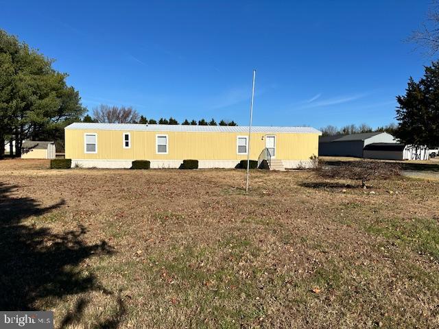 Discover the charm of this well-maintained 1993 Fleetwood manufactured home, offering a cozy retreat on a spacious 1.34-acre lot. With 980 sq. ft. of living space, this single-wide home features three inviting bedrooms and a full bathroom, perfect for relaxation and comfort.  Step outside to find a generous front and rear yard, ideal for outdoor gatherings or quiet moments in nature. The ample driveway provides off-street parking for up to four vehicles, ensuring easy access for you and your guests. This property combines the warmth of home with the potential for outdoor enjoyment, making it a perfect choice for those seeking a peaceful lifestyle, yet close to shopping and just 30 minutes to the area's resort beaches. Plenty of room for a shop / detached garage. No HOA fees or city taxes. Embrace the opportunity to create lasting memories in this delightful space!